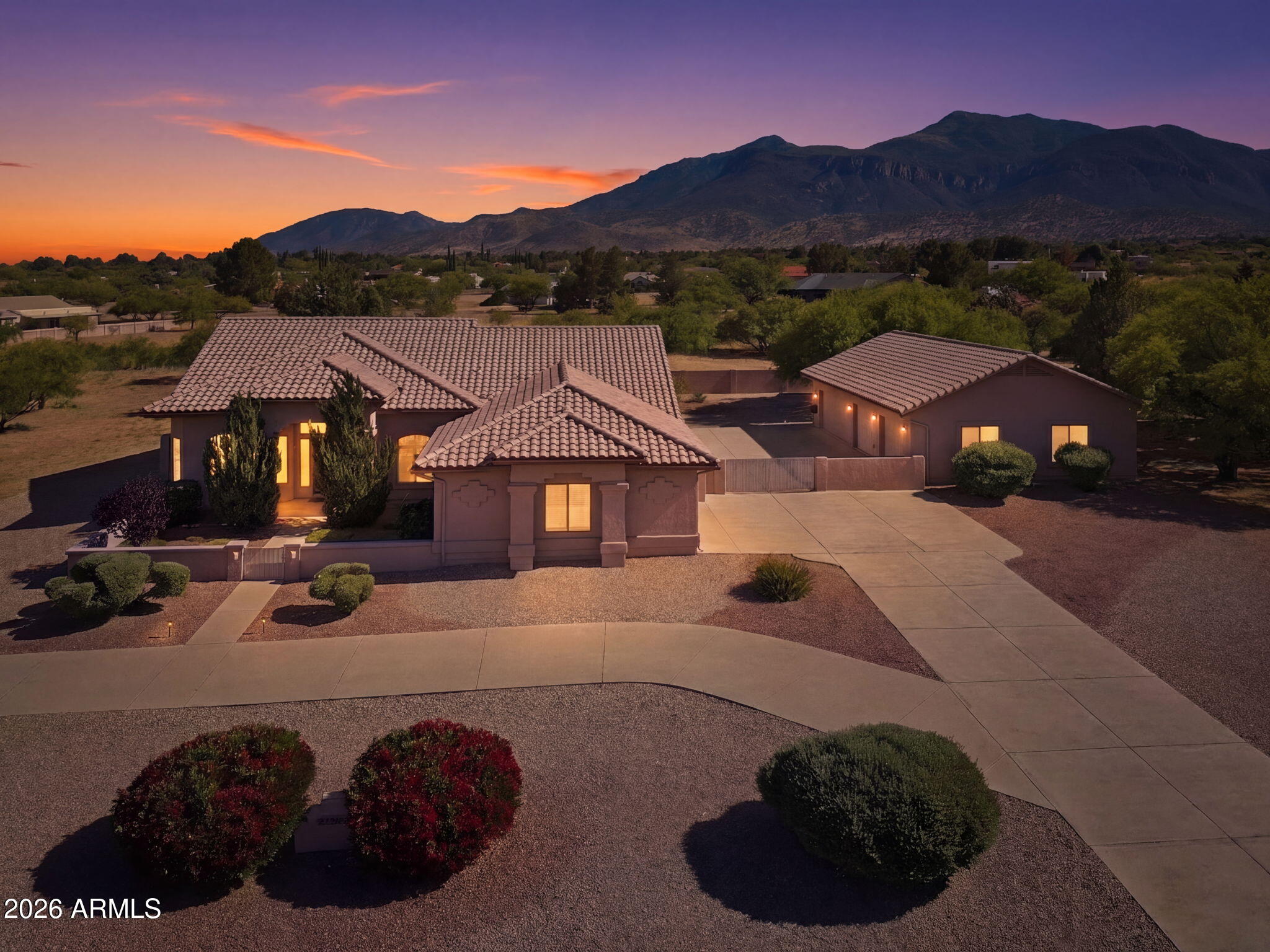 Introducing a luxury Sierra Vista retreat offering 2794 sqft on over an acre, with breathtaking Huachuca Mountain views. This spacious residence features three generous bedrooms and two baths, plus an office in the main home. The gourmet eat in kitchen shines with an island, plus an elegant breakfast nook perfect for daily meals or entertaining. A separate formal dining room adds elegance, while the expansive primary suite reveals a spa like primary bath. Outdoors, the landscaping is an easy to maintain blend of Bermuda Grass, bushes, and gravel with an above ground pool, and a detached 4 car garage with a Mechanics Pit! The third garage converts easily into Guest Quarters or a Man Cave! Discover an ideal blend of refined design, outdoor allure, and flexible space!