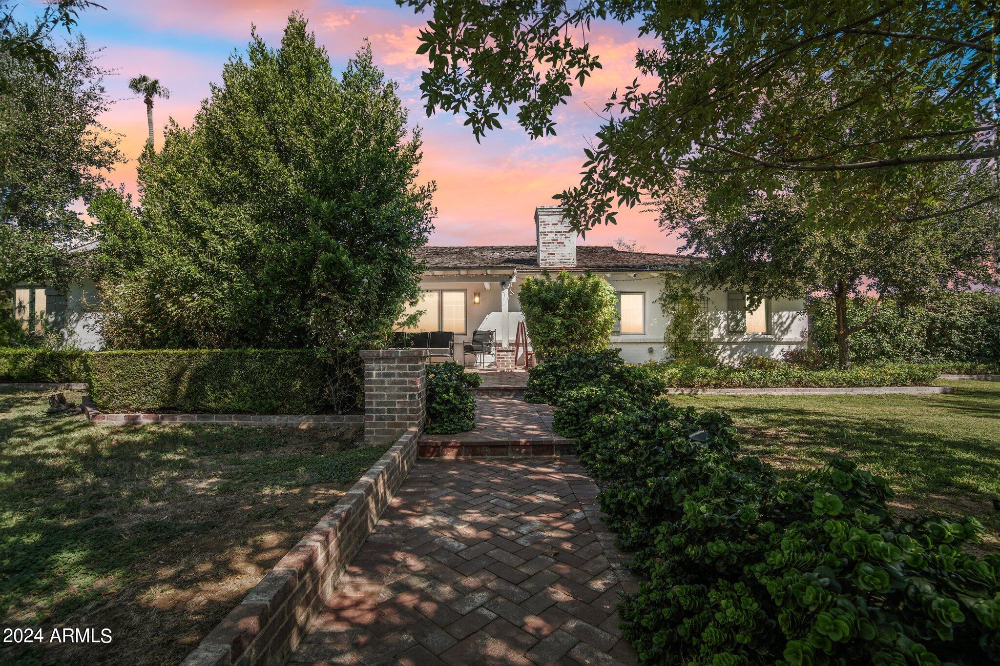 This Spectacular Beautiful Custom home in the heart of Arcadia on a large Premium Lot is the epitome of comfort & style with High-Quality finishes.
Meticulously maintained, this move-in-ready estate has a chef's kitchen, a culinary dream, features a subzero fridge/freezer, a Wolfe 8-burner gas cooktop, a double oven, & a Butler Pantry, a large exquisite marble island with ample storage. The open, spacious floor plan, bathed in natural light, is accentuated by high ceilings, offering an inviting atmosphere for seamless living. This home has 4 large bedrooms & three ensuites, which ensures ultimate privacy and relaxation. The backyard oasis is an entertainer's Private paradise, with a heated pool, outdoor fireplace, Built-in BBQ, & cozy pergola TV area on the elegant brick patio. Must See Set on a large, private lot with a 3-car garage, this luxurious haven is perfectly located moments from Arizona's finest shopping, dining, and entertainment. Don't miss your chance to experience Arcadia's premier lifestyle!