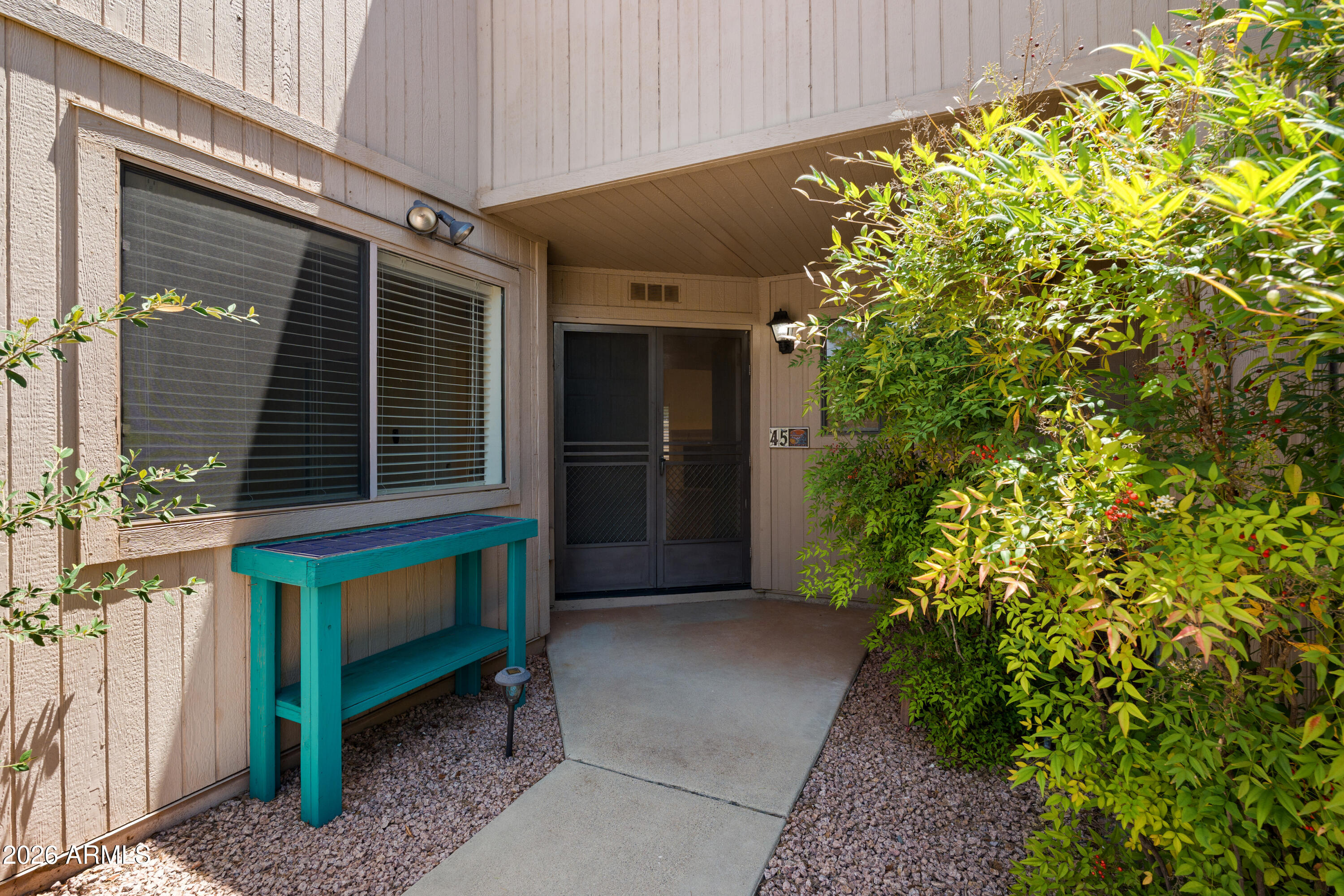 Move-in ready and beautifully updated, this 3-bedroom, 3-bath townhome is ideally located in the heart of West Sedona, offering convenience to shopping, dining, hiking trails, and all the amenities Sedona is known for. Step inside to soaring cathedral ceilings and a light-filled open floor plan that creates a spacious and welcoming atmosphere. The remodeled kitchen features stylish new cabinetry, attractive countertops, and stainless steel appliances, while new wood-look laminate flooring flows throughout the home. Enjoy cozy evenings by the gas fireplace or relax outdoors on the private, fully fenced patio. Elegant wood shutters add warmth and character throughout. The spacious primary suite offers its own private balcony, along with a luxurious bath featuring dual sinks and a separate soaking tub and shower.  The flexible floor plan includes two bedrooms upstairs and one bedroom on the main level--ideal for guests, a home office, or multi-generational living. Additional peace of mind comes with a newer HVAC system, and water heater.  Owner financing may be available with 30% down, providing a unique opportunity for qualified buyers.  HOA covers sewer, trash, clubhouse and pool.