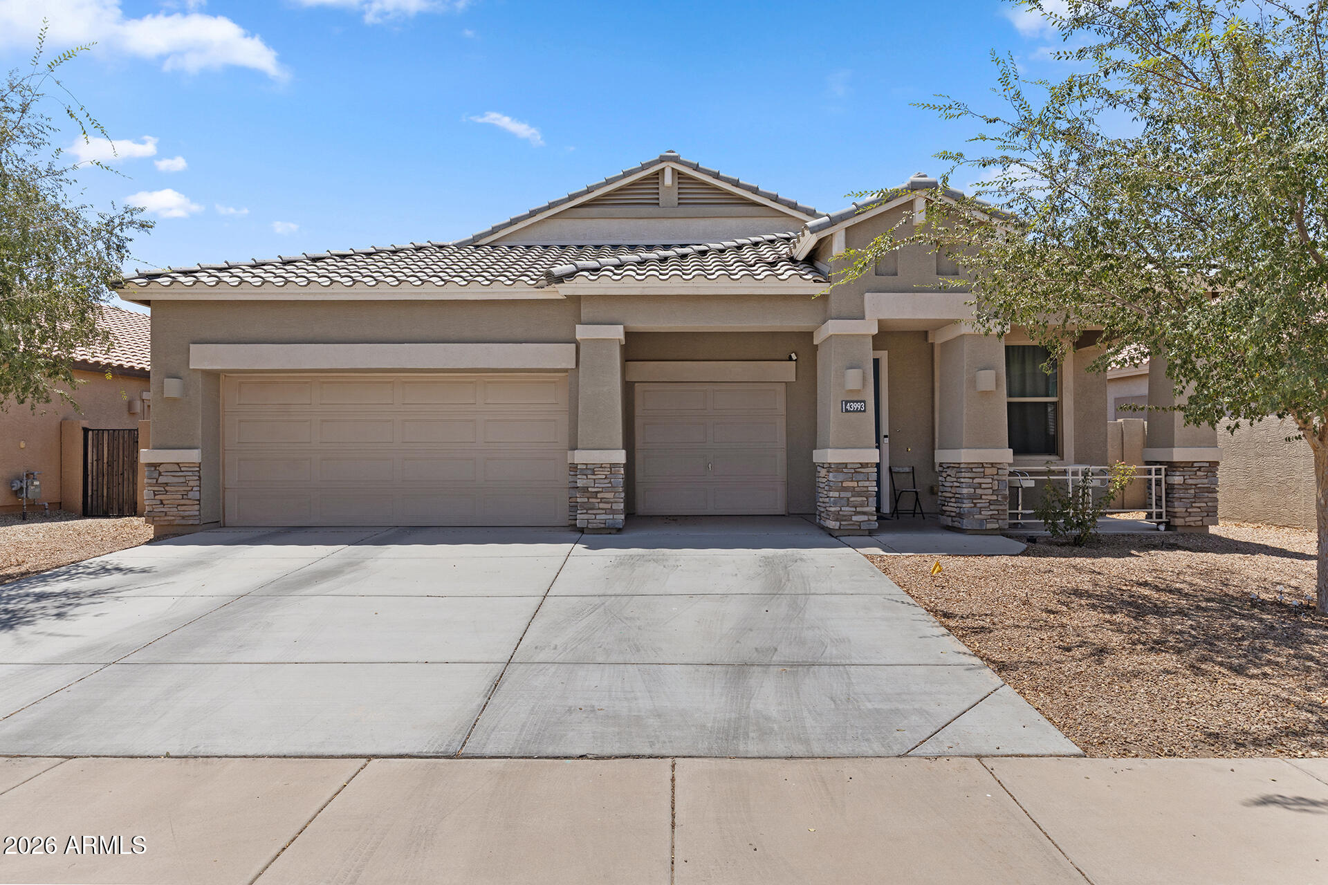 Space, style, convenience--and incredible value with so many items included! Located in Maricopa's premier subdivision of The Villages at Rancho el Dorado, which features 2 community pools, a stunning lake, private gym & clubhouse. This spacious 4-bedroom, 2-bath home offers 2,150 sqft of comfortable living in a desirable location. The thoughtfully designed floor plan features extra-wide doorways for improved accessibility, a generous primary suite with blackout shades and voice-activated lighting, and a top-notch upgraded en-suite bath. This kitchen has a large Farmhouse sink with multiple features and a beautiful Mother-of-Pearl backsplash for the WOW factor! The backyard boasts an above-ground private spa, outdoor TV, BBQ grill, and outdoor dining set, making this an exceptional move-in-ready opportunity. Enjoy ample parking with a 3-car garage and two slab spaces, as well as fantastic community amenities. This home combines space, convenience, and outstanding value--all in one package! See the additional home features and the conveying items list in the documents section.