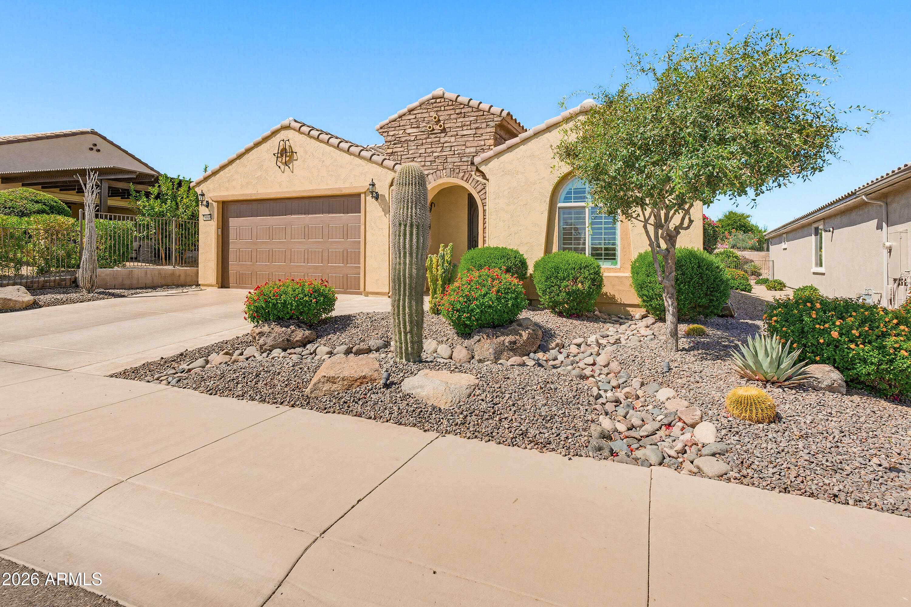 Thoughtfully updated, meticulously maintained & loaded w/ premium upgrades, this exceptional fully furnished Haven plan is truly move-in ready & offers the very best of Sun City Festival living. Featuring a custom steel front door, private side courtyard, new luxury vinyl plank flooring throughout, Plantation shutters, remodeled primary bath, new kitchen appliances, granite countertops & spacious kitchen island. The open great room design is complemented by a versatile flex room ideal for an office or additional living space. Additional bonuses: owned solar, modular garage floor tiles, built-in garage storage cabinets, extensive French drain landscape improvements, an extended patio w/ fire pit & built-in grill, pet friendly synthetic grass & low-maintenance desert landscape & much more!!!