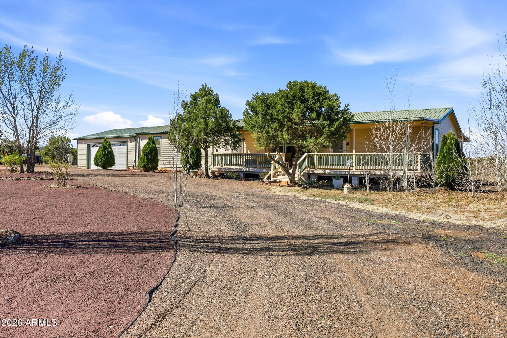 Discover wide open living with this well-kept 4- bedrooms 2-bath home on a fully usable parcel in Concho, Az. Featuring circular driveway mature trees, and plenty of spaces for vehicles, RV's, animals, or future expansion. Inside offers a bright, open layout with a spacious living room, abundant natural light and a functional flow into the kitchen and dining area.The kitchen includes ample cabinetry generous counter space and a center island, while a pellet stove adds year round comfort. The attached garage provides added convenience and storage. Enjoy low maintenance landscaping, a covered porch