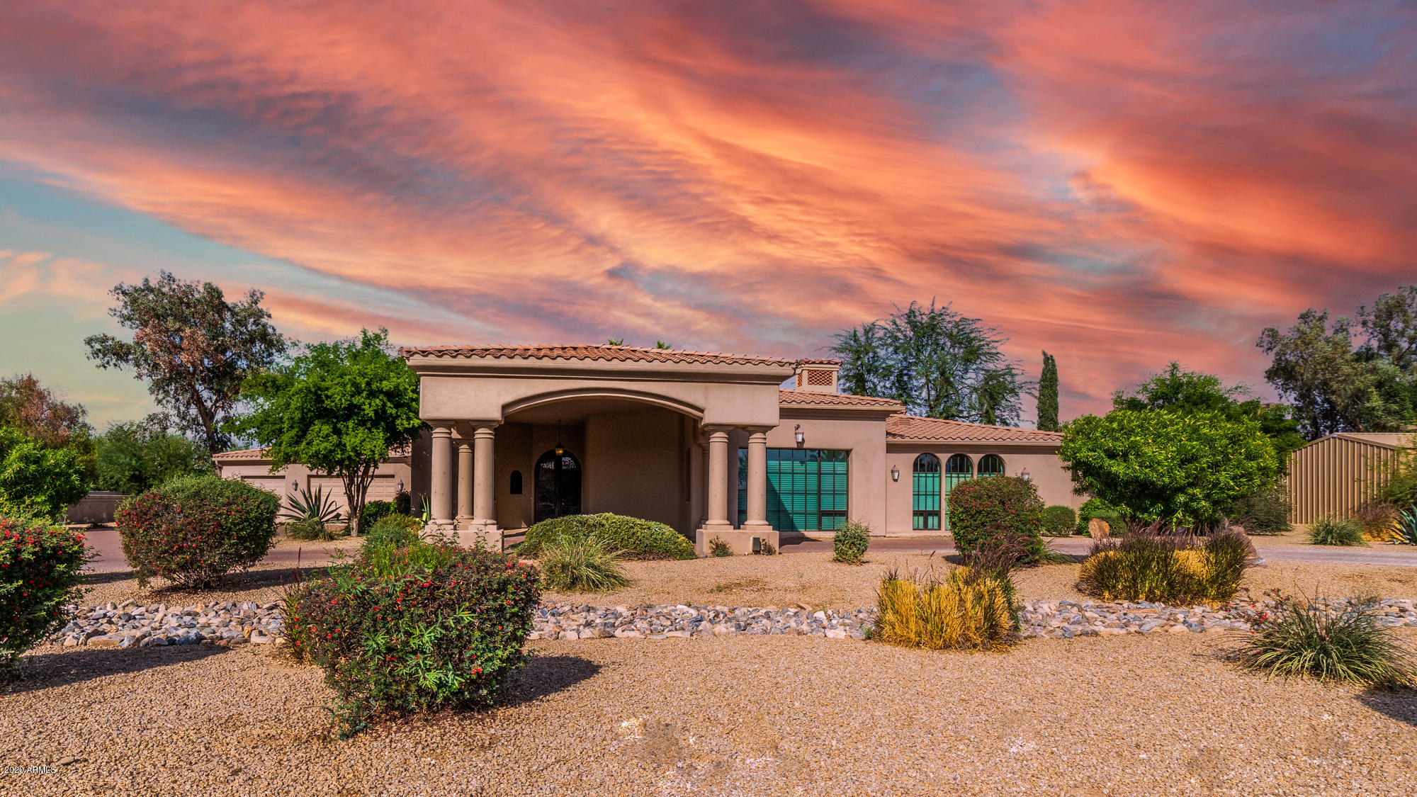 Arabian Park Drive is conveniently located in the Shea Corridor, just minutes from West World. Remodeled in 2012, this home is elegance with rustic character through the finest finishes; reclaimed Colorado barn wood flooring, stone walls, wood-beamed ceilings, 2017 complete interior paint, Alder doors, iron lighting fixtures, Cantera accents, and wood casement doors/windows and all new window coverings including Hunter Douglas blinds. The showpiece of this estate is the dramatic great room, offering room to entertain guests at the wet bar or settle in by the cozy fireplace. The bedrooms are just as beautiful with an entryway to the master suite that sets the stage to a luxury master retreat. With a brick barrel ceiling hallway leading into the master bedroom, a private fireplace, and a rejuvenating master bath with soaking tub and deluxe steam shower. That's not all... be sure to view the rustic office, fully-equipped media room, loft sitting room, and two additional bedrooms. Still need additional space? Then the guest house should work with a complete kitchen, family room, laundry, bedroom and bathroom. Enjoy the indoor/outdoor living spaces including a sparkling pool and elevated spa surrounded by boulder waterfalls. 
While the main house is spectacular on its own, the real highlight of this property is the incredible horse facilities, which includes 25 matted box stalls with auto waterers, indoor wash stall, tack and feed rooms, automated fly control, and cooling mister fans. The barn also has an office, lounge, and a 2 bedroom apartment with kitchen and bath. Next to the barn is a performance arena (175x75) with sprinklers, lights, and large pavilion with a modern outdoor kitchen. The grounds of this property also include a 60 foot MD bull pen, and enclosed shavings storage, while being completely gated and secured. The five acre property on a private street is a rare find in this area of Scottsdale.