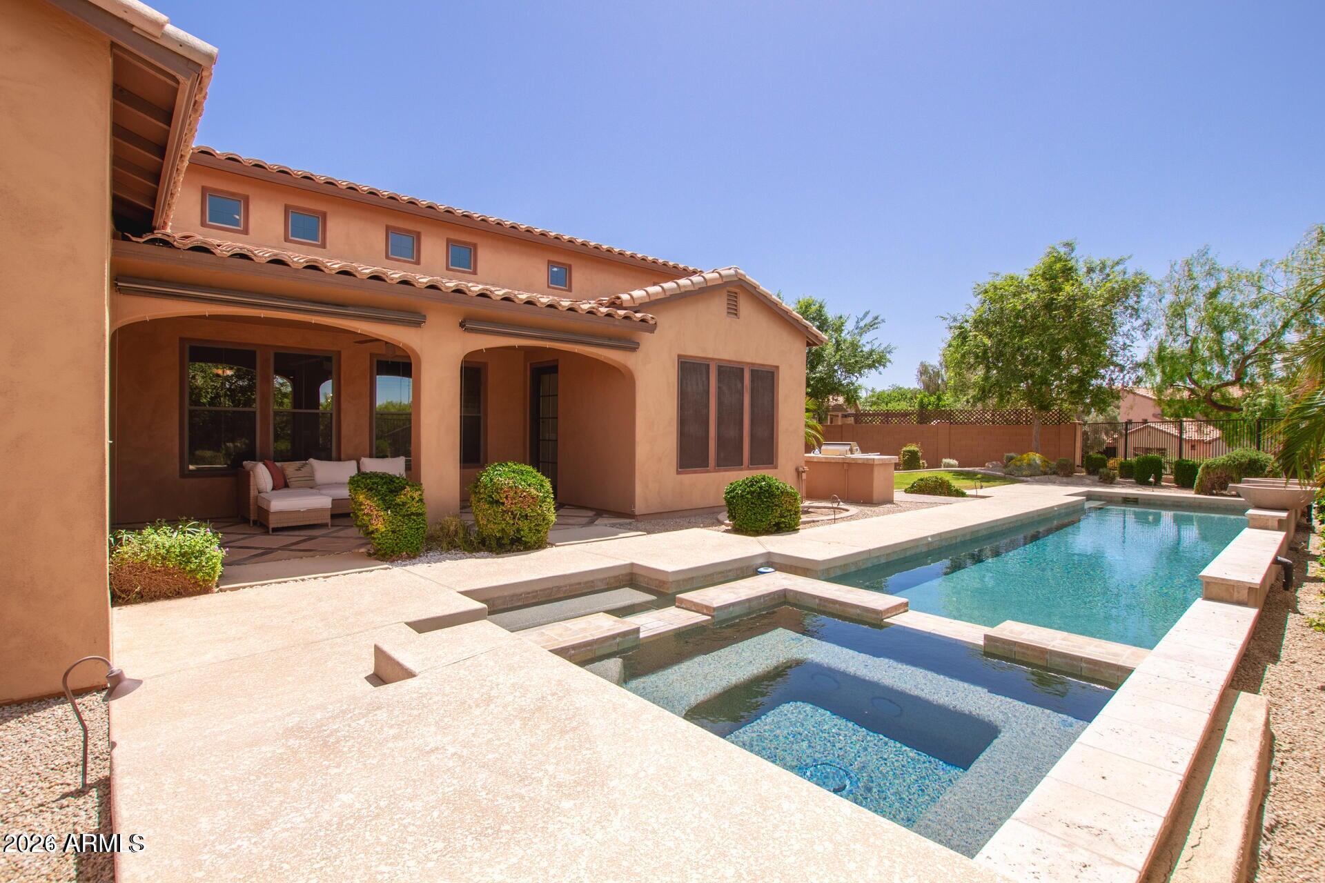 Experience exceptional living in one of Paradise Valley's most sought after gated communities.  Ideally located minutes from Mayo Clinic, Whole Foods, Kierland, premier shopping, acclaimed restaurants and endless outdoor recreation. This beautifully appointed home offers the perfect blend of Luxury, Comfort & Convenience. 
Step inside to Soaring Ceilings and an Open, light filled floor plan designed for both everyday living and effortless Entertaining. 
Gourmet Kitchen features abundant workspace + flows seamlessly into the spacious Family Room, creating the Heart of the home.
The versatile Lower Level offers a private bedroom suite along with generous family room / flex spaces ideal for Guests, media room, multigenerational living.
Enjoy your Backyard Retreat complete with sparkling pool, grassy play area and plenty of room for relaxing.
Don't miss this incredible opportunity to enjoy Luxury Living in an unbeatable location close to EVERYTHING!
