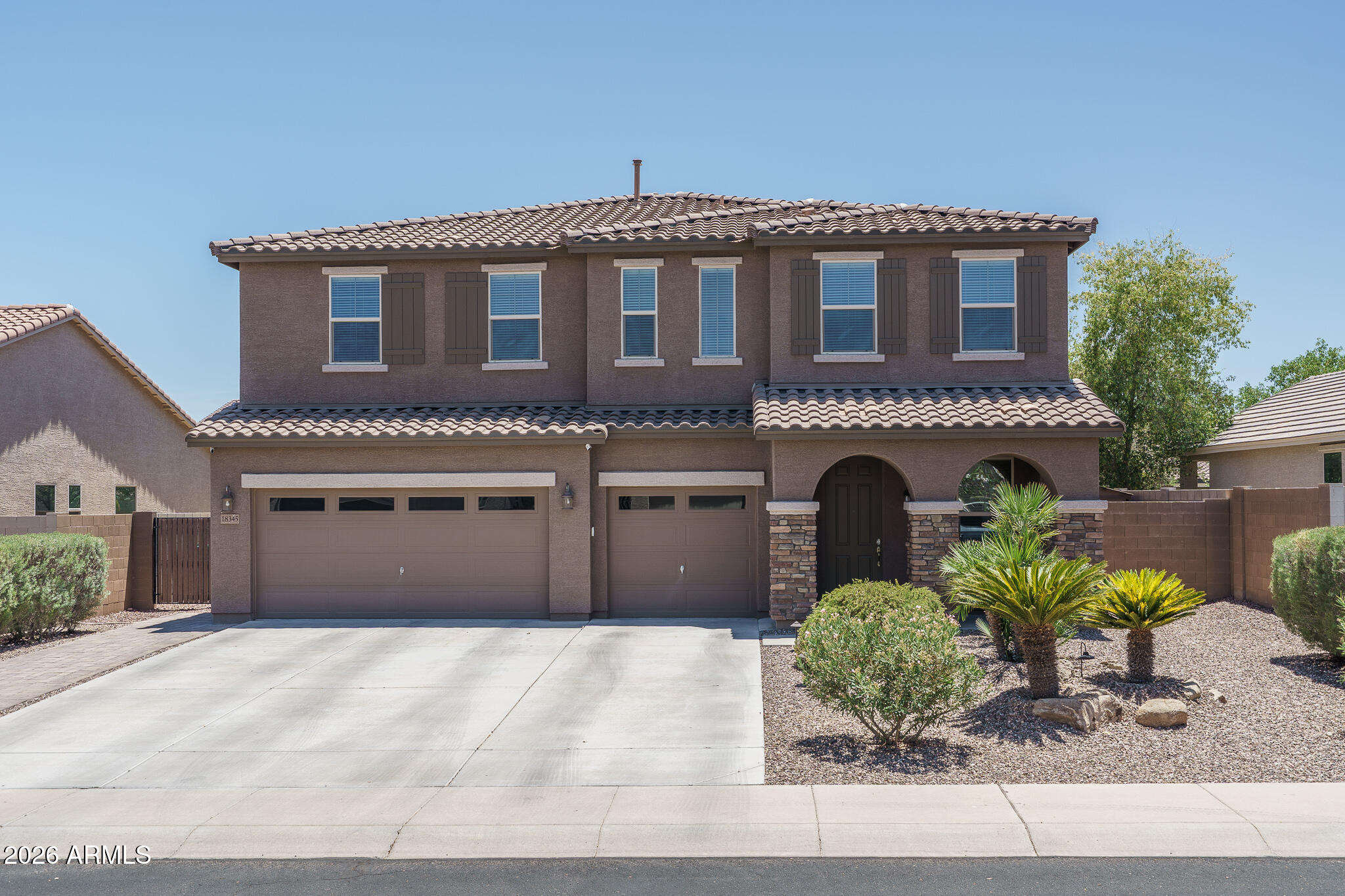 This beautifully cared-for home, well maintained by its original owner, sits on an over- sized North/South facing lot and offers an impressive 6 bedrooms and 3.5 baths across 3,297 Sq Ft of comfortable living space with a 3-car garage. The thoughtful floor plan includes a welcoming front living and dining area, a spacious great room that flows seamlessly into the kitchen and an upstairs loft perfect for additional lounging or play. The kitchen stands out with maple cabinetry topped with crown molding, granite countertops, stainless steel appliances, a double-door pantry and a generous island with a breakfast bar. A sliding glass door opens to a covered patio, an extended paver patio and a large backyard with lush grass. One side yard offers a storage shed, while the other provides a convenient double gate. Inside, one bedroom is located on the main level, while the primary suite and four additional bedrooms, all boasting walk-in closets, are upstairs. The primary retreat features a double- door entry, a spacious en-suite bath with dual sinks and an oversized shower complete with a dry-off area and an individual linen closet. Two secondary bedrooms share a Jack-and-Jill bath, with another full bath nearby for the other bedrooms. Extra highlights include a half bath on the first level, an open view to below from upstairs and 2 additional linen closets completing this exceptional home's blend of comfort, space and functionality.