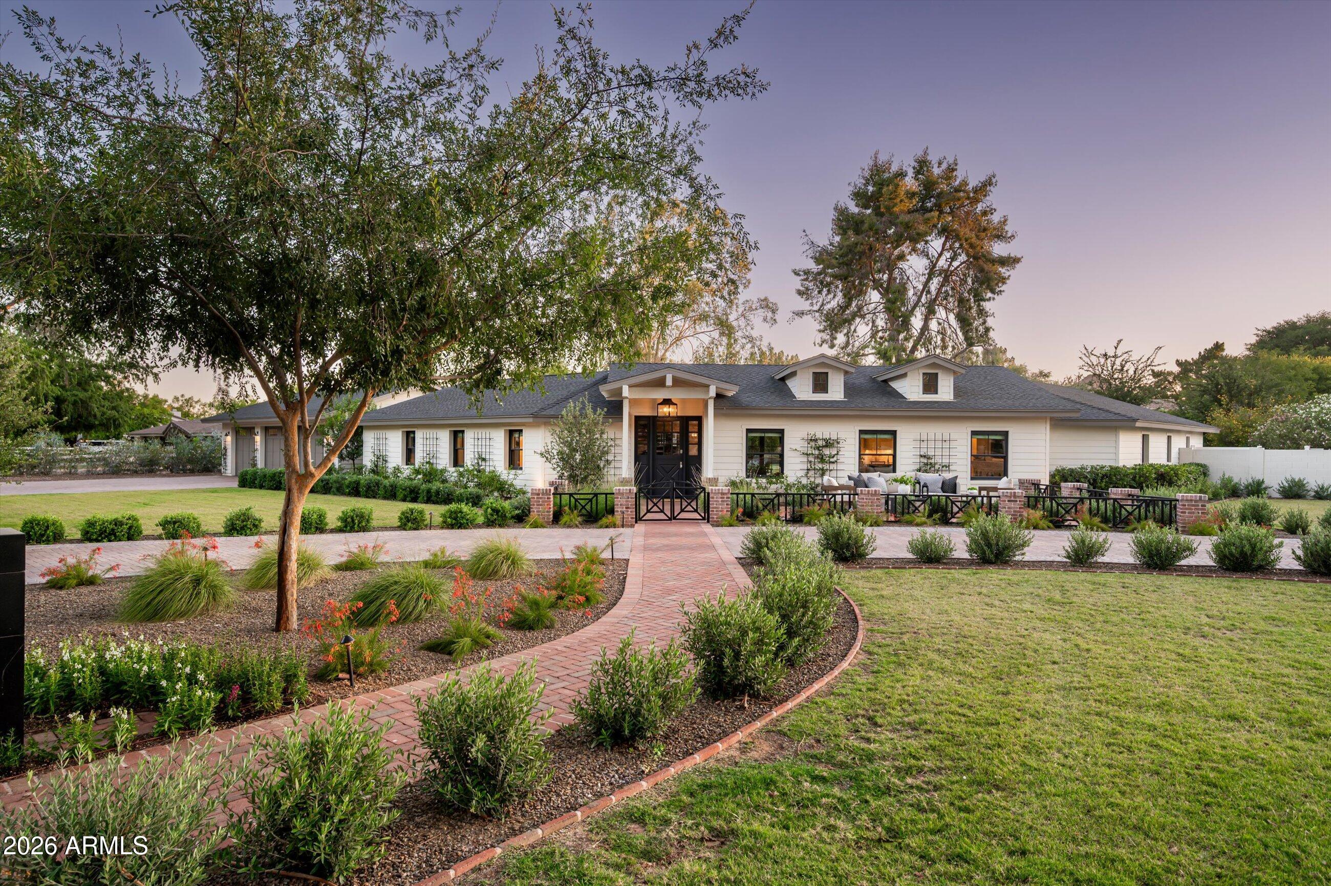 A rare opportunity to own one of Paradise Valley Farms' most complete lifestyle properties--where luxury living, recreation, and guest accommodations come together on a private 1+ acre corner lot. The property is designed for the way today's buyers want to live, entertain, and host.
The 4,000+ -square-foot main residence features four en-suite bedrooms, a dedicated office with custom built-ins, walk-in closet and adjacent to a full bathroom; Office could be used as the 5th ensuite bedroom in the main house. The great room, kitchen and dining rooms have 16'+ vaulted ceilings, wide-plank hardwood flooring, and wall of glass that creates a seamless connection to the outdoor living spaces. The open-concept floor plan is filled with natural light and anchored by a beautifully appointed kitchen featuring custom cabinetry, premium finishes, and generous gathering spaces.

Beyond the main home, a fully detached guest house provides exceptional flexibility for extended family, visitors, multigenerational living, or a private retreat. Together, the property comfortably accommodates large gatherings while maintaining privacy and comfort.

The backyard delivers the lifestyle buyers are actively seeking, with a full pickleball and sport court, expansive covered patios, manicured grounds, and multiple spaces for dining, entertaining, and relaxation. A versatile bonus room adjacent to the three-car garage is currently configured as a private fitness studio, complete with glass doors opening directly to the backyard, creating an ideal indoor-outdoor wellness space.

Few properties offer this level of functionality, privacy, and recreation on a full acre in one of Scottsdale's most desirable neighborhoods.

With no HOA, the sky is the limit for someone who wants to expand the footprint to make it fit their needs.