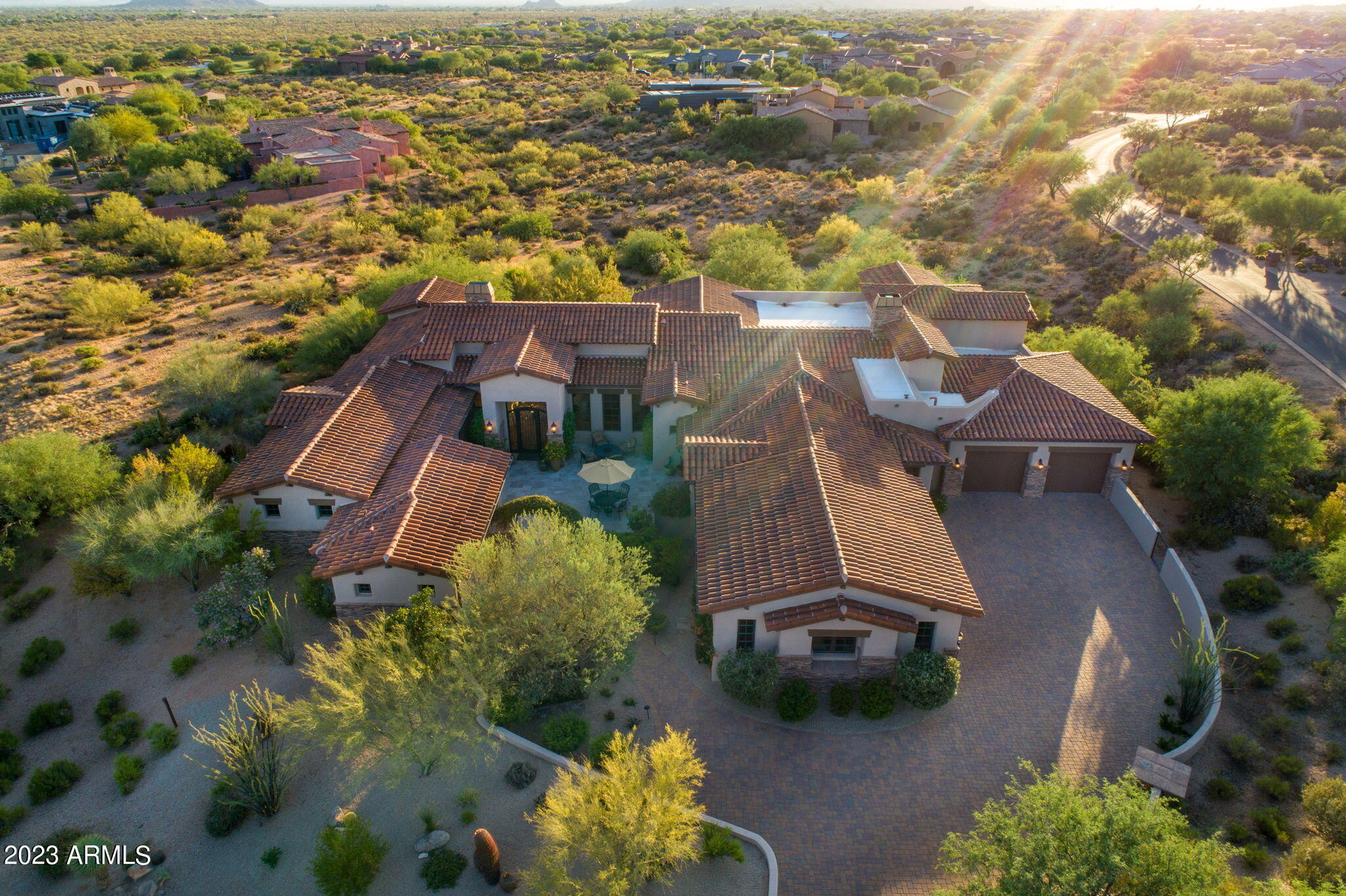 Located on one of the largest parcels of land in the prestigious Mirabel Club golf community, this home has 4 bedrooms, 5.5 bathrooms plus an office/game room. The current owners also added on a large two room guest house complete with living room, bedroom (5th bedroom), bath and kitchenette. This space is ideal for live in help or in-laws & has its own garage. There is plenty of room on the nearly 3 acres to add on to make this truly one of north Scottsdale's most impressive family compounds. You enter the premises through a lush courtyard complete with flowering vines & outdoor dining/relaxing spaces. This home has been recently renovated and boasts an open floor plan with multiple sets of French doors connecting the indoor and outdoor spaces. Truly a rare find in north Scottsdale.