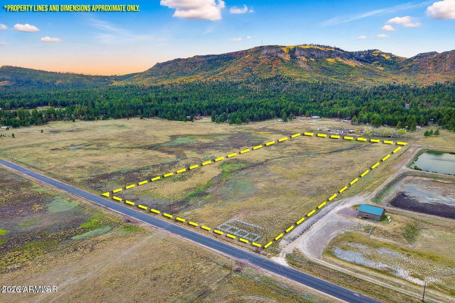 This 15-acre flat meadow is located near Alpine Townsite, offering an ideal space for a business or storage yard, as well as a year-round spot to park your RV. Power lines run along the northern fence, and water is easily accessible. If connecting to sewer, a solid separation tank will be required. Enjoy the serenity and peaceful atmosphere and views of this beautiful piece of land, with paved access to the parcel. Alpine is renowned for its abundant wildlife, scenic hiking trails, pristine lakes, and excellent fishing and hunting opportunities.