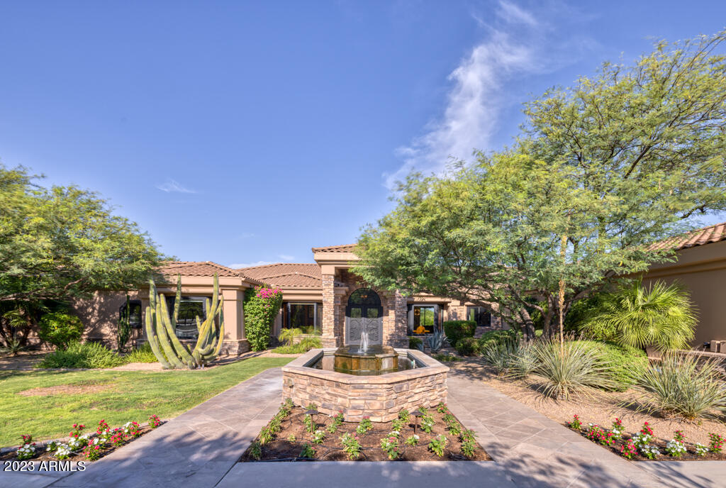 Welcome to this charming 5,000 sqft, 5-bed, 6-bath + paneled library w/ 4 car garage abode offering  Camelback and Praying Monk views. Enjoy the privacy of tall oleanders surrounding the outdoor space + a bike path to Kiva School. The expansive backyard w/mature landscaping is complete w/ a batting cage, herb garden, multiple grassy areas, + spacious entertainers patio w/ built in bbq.  The kitchen opens to the light and bright remodeled family rm, featuring new floor-to-ceiling sliding pocket doors that lead to the lush backyard. The primary bathroom, remodeled in 2021, is fresh + luminous w/ white marble floors + countertops. There is also a flexible space in the primary bedroom, perfect for a gym or expanded closet. This property is just minutes away from fine dining + premier shopping