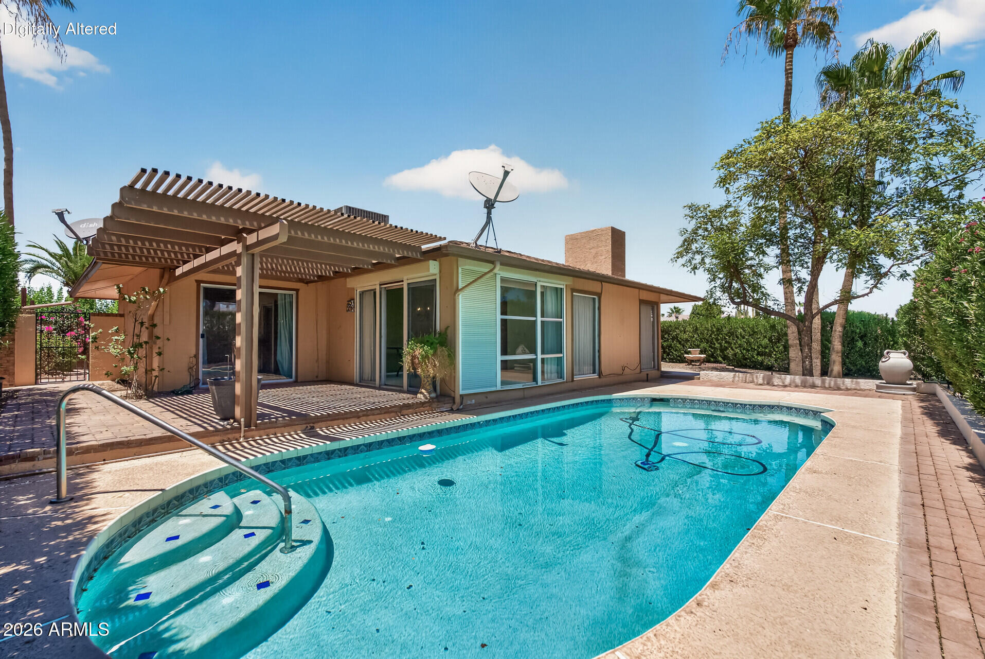 Exceptional value with outstanding potential. This expanded and rarely available Montezuma model features a unique floor plan with two spacious primary suites and a sparkling PebbleTec pool. Major improvements include a new 5-ton HVAC system installed in 2025 and a roof replaced within the past 4-5 years.

The kitchen is equipped with stainless steel appliances, while the oversized enclosed laundry and utility room offers abundant storage space. Ceiling fans throughout enhance comfort and energy efficiency. Floor-to-ceiling windows in the living room and Arizona room fill the home with natural light, creating an open and inviting atmosphere.

Outdoor living includes a covered patio, a refreshing PebbleTec pool, and a private walled side patio ideal for relaxing in complete privacy. Being sold in its current condition, this home is attractively priced below market value, presenting an excellent opportunity for buyers to update, personalize, and create their ideal home while benefiting from solid construction, major system updates, and a desirable floor plan. ***Tesla Solar Lease Payment is $63.15/mo  currently and escalates slightly each year up to a maximum of $85.27/mo over the remaining 10 years.***