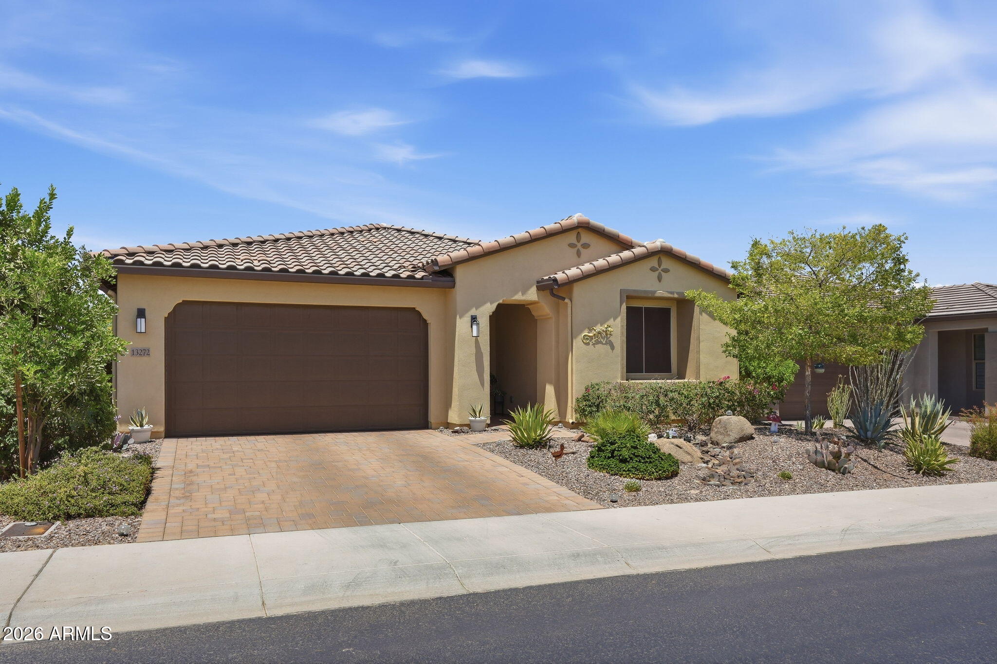Welcome to this beautifully upgraded 2022 Mosaic floor plan in Trilogy at Vistancia. Situated on a premium wash lot with desert and mountain views, this exceptional home offers an open floor plan and seamless indoor-outdoor living.

Designed for everyday living and entertaining, this home offers 2 bedrooms, 2 bathrooms, a versatile office/flex room, and a spacious great room with an upgraded multi-slide glass door opening to the covered patio and backyard.

The gourmet kitchen showcases a large island, granite countertops, white cabinetry, and stainless-steel appliances, including a gas cooktop and wall oven.

The private owner's suite includes a dual-sink granite vanity, a tiled walk-in shower, and a generous walk-in closet. Wood-look tile flooring flows throughout the main living a and a custom stained-glass front door adds a unique touch to the home's welcoming entry.

Step outside to enjoy the extended paver patio, view fencing, and desert and mountain views--perfect for relaxing, entertaining, or enjoying your morning coffee.

Trilogy at Vistancia offers an exceptional collection of amenities, including championship golf, pickleball, tennis, resort-style pools, a state-of-the-art fitness center, on-site dining, a culinary studio, scenic walking trails, and an active calendar of clubs, events, and activities.