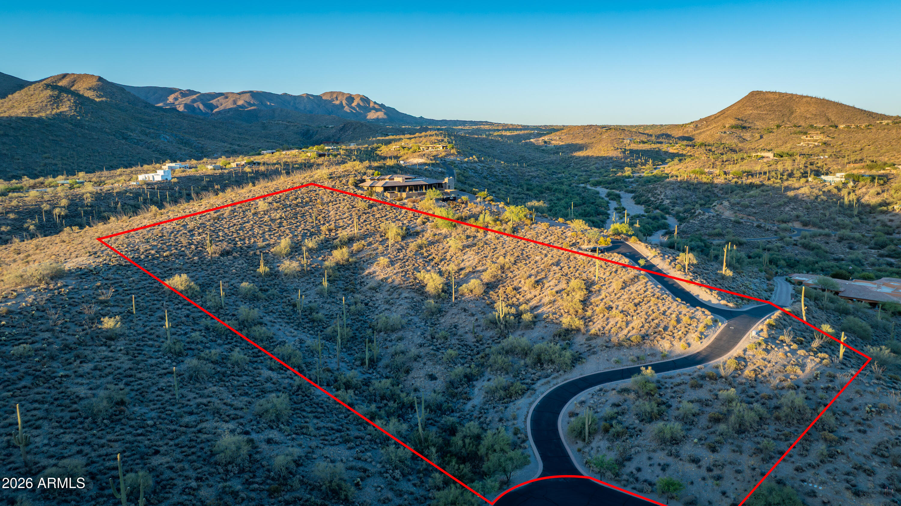 A rare opportunity to own one of Ocotillo Ridge's most coveted homesites. This nearly 5-acre hillside parcel offers commanding panoramic views stretching from Black Mountain and Pinnacle Peak to the McDowell Mountains and the glittering lights of the Valley below. Perfectly positioned at the end of a private cul-de-sac within this exclusive gated community, the property combines ultimate privacy with extraordinary natural beauty. Surrounded by distinguished custom estates, this premier lot provides an unparalleled setting for a legacy home, all within minutes of Carefree and Cave Creek's renowned dining, golf, shopping, and lifestyle amenities.