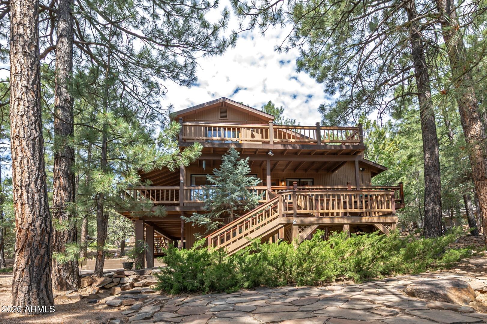 Welcome to your cozy mountain retreat in the desirable Portal 3 subdivision! This charming 3-bedroom, 2.5 bath cabin offers beautiful views of Milk Ranch Point and a warm, inviting atmosphere perfect for enjoying the mountain lifestyle. The primary suite is conveniently located on the main level, while upstairs you'll find two additional bedrooms and a versatile loft area, ideal for extra sleeping space or a home office. Step outside to the covered deck or open deck and take in the peaceful surroundings and scenic views. A spacious 2-car garage provides plenty of room for vehicles, outdoor gear, and storage. Whether you're looking for a full-time residence or a relaxing mountain getaway, this cabin offers the perfect place to unwind and enjoy all that mountain living has to offers