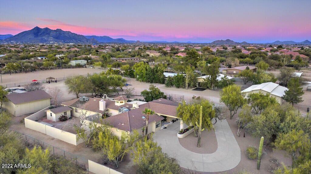 THIS IS IT! YOU WILL NOT WANT TO MISS THIS ONE!
TRULY THE FINEST 5 ACRES HORSE RANCH IN THE MIDDLE OF THE CITY ON THE MARKET WITH PRIVACY! WOW! PRICED TO SELL! EXCELLENT LOCATION! SCOTTSDALE/CAVE CREEK/MINUTES TO WESTWORLD/DYNAMITE ARENA. WALK TO FANTASTIC RESTAURANTS!  CITY OF PHOENIX WATER. PAVED ROADS. SO MANY POSSIBIILTES. MASSIVE/HUGE  ARENA-MAIN HM 3226 SQ FT + 2 GUEST HOUSES (1793 SQ FT). HUGE RV GARAGE & WORKSHOP. RV HOOK UPS. 4 CUSTOM BARNS. OFFICES.  ALL IMMACULATE. FIRST CLASS! MOVE IN READY! MOUNTAIN VIEWS MAJESTIC SUNSETS. 
PRIVATELY WALLED AND GATED. ENTIRE PERMITER FENCED. PRIVACY YET IN THE MIDDLE OF THE ACTION! *** CLICK ON THE SUPPLEMENT TAB FOR FURTHER DETAILS. *** THIS IS IT! PRICED TO SELL!

INCREDIBLE Horse Property In The MIDDLE OF THE ACTION! Excellent Location! SCOTTSDALE/Cave Creek!
Fully walled & gated makes this an extremely private facility.
Immaculately kept. Move in ready.

BRING YOUR FRIENDS & FAMILY! BRING YOUR HORSES, COWS, DOGS, ROOM TO ROAM. RIGHT IN THE MIDDLE OF ALL OF THE ACTION WITH EXTREME PRIVACY! HIGHLY DESIRED LOCATION! SCOTTSDALE/CAVE CREEK!
EXCELLENT FOR ENTERTAINING AND ENJOYMENT! 5 ACRES WALLED FENCED AND PRIVATELY GATED! ALL PAVED ROADS!
EXCELLENT FOR PERFORMANCE HORSES WITH MASSIVE ARENA! INCREDIBLE VIEWS!
YOU CAN HAVE IT ALL!

City of Phoenix water, City of Phoenix Fire & Ambulance (NO rural metro subscription required). Septic's (2) have been inspected/certified/pumped. Termite inspections has been completed. All building roofs have been inspected. Ready for you to move in!

*****PROPERTY DETAILS******

BARN #1
5 Oversized stalls (12x16) & tackroom/office/feed room, plus two groom/ready stalls (easily converted into two stalls for total of 7 stalls). Insulated ceilings throughout barn. Ceiling fans. Individual Programmed light in each stall. Individual electric to each stall. Automated fly system in each stall and barn.

BARN#2
5 Stalls each w/attached large paddock sand runs. Insulated ceilings throughout barn. Ceiling fans. Individual Programming lights for each stall. Individual electric to each stall. Automated fly system in each stall and barn.
Plus, two wash stalls (tankless hot water heater for bathing), plus 5 groom/ready areas, plus large tack room, plus office, plus laundry room, plus bathroom.

BARN #3
12 stall (12x16) Each stall individual programming for automated lighting. Each stall electric outlet. Automated fly system in each stall and barn.

BARN #4
6 stalls (12x16). Automated programming for lighting. Automated fly system in each stall.

All barns have matted stalls & individual water hook up to each stall. ROOM TO ADD MORE STALLS.

7 outside stalls all with attached runs. ROOM to add more

Property has numerous large turnouts.

MASSIVE ARENA!~Excellent for performance horses (roping, reining, jumping, dressage).

Huge round sand training arena.

Full electric hook up for eurosizer horse walker

Custom outdoor wash rack area.

Custom tie posts (2).

Custom Hay Barn

HUGE RV Garage/shop
RV parking hook-up with electric, water, septic

Separate GATE/entrance for hay and manure dumpster delivery.

Main house has beautiful rose garden, 3BR 2.5BA, 3 car garage, 3 fireplaces, oversized rooms, wood beam ceilings & open flowing floor plan. Plus, enclosed AZ room. Great for entertaining! Main house remodel almost finished ready for final touches by buyer if buyer wants to change appliances, windows, sliding glass doors. 

TWO GUEST HOUSES:

Guest house two-bedroom, one bath, full kitchen with oversized fenced yard.

Guest house with one large master bedroom with walk in closet and full bathroom. Large open floor plan (easily converted to three bedrooms). Full size kitchen with island/breakfast bar dining in kitchen area, living room/great room. Attached laundry room.


ENTIRE PROPERTY WELL DESIGNED AND SPACIOUS FOR PRIVACY. FEELS MORE LIKE TEN ACRES!


BEAUTIFUL Horse Paradise! In The HEART OF THE CITY!

Quick close! Move in ready!
Welcome home today!

Buyer and buyers representative shall conduct due diligence for information provided.