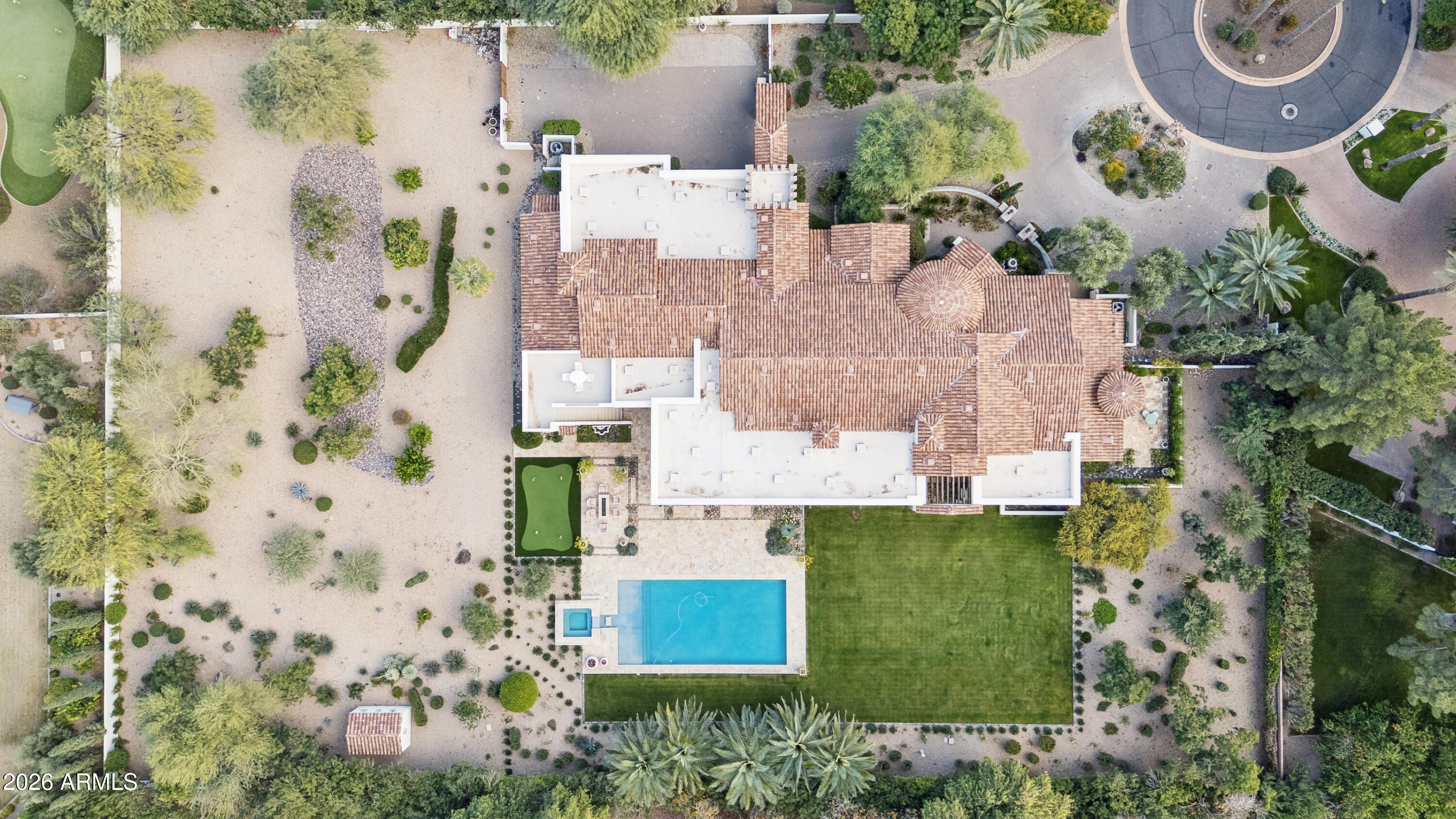 Nestled in guard-gated Judson community, Paradise Valley, this 7,671 sq ft estate on 1.629 acres blends reimagined Tuscan charm with modern Mediterranean style. Over $2.5M in upgrades (past 2.5 years) include new tile roof, fresh paint, restored beams, Venetian plaster, and Cristallo Quartzite.Open great room flows to gourmet kitchen with paneled Sub-Zero/Wolf/Cove appliances, custom cabinetry, coffee bar, wet bar, and glass-front wine room. 4 en-suite bedrooms + office (potential 5th bed) with full bath. Luxe primary suite offers spa bath, stone shower, soaking tub, Kallista fixtures, workout room, and private patio/garden.Smart features: 3 new Trane ACs, 3 NEW Navien tankless heaters, Lutron automation, Sonos/B&O audio, whole-home water filtration, new irrigation/lighting, New alarm.Resort backyard with mountain views: refreshed pool (2024), travertine patios, putting green, outdoor fireplace, new firepit. Oversized 4-car garage; lot allows major expansion (extra garages/guest house).Prime location near Ritz-Carlton, golf, hiking, dining. Turnkey luxury masterpiecerare opportunity.(1,248 characters including spaces)