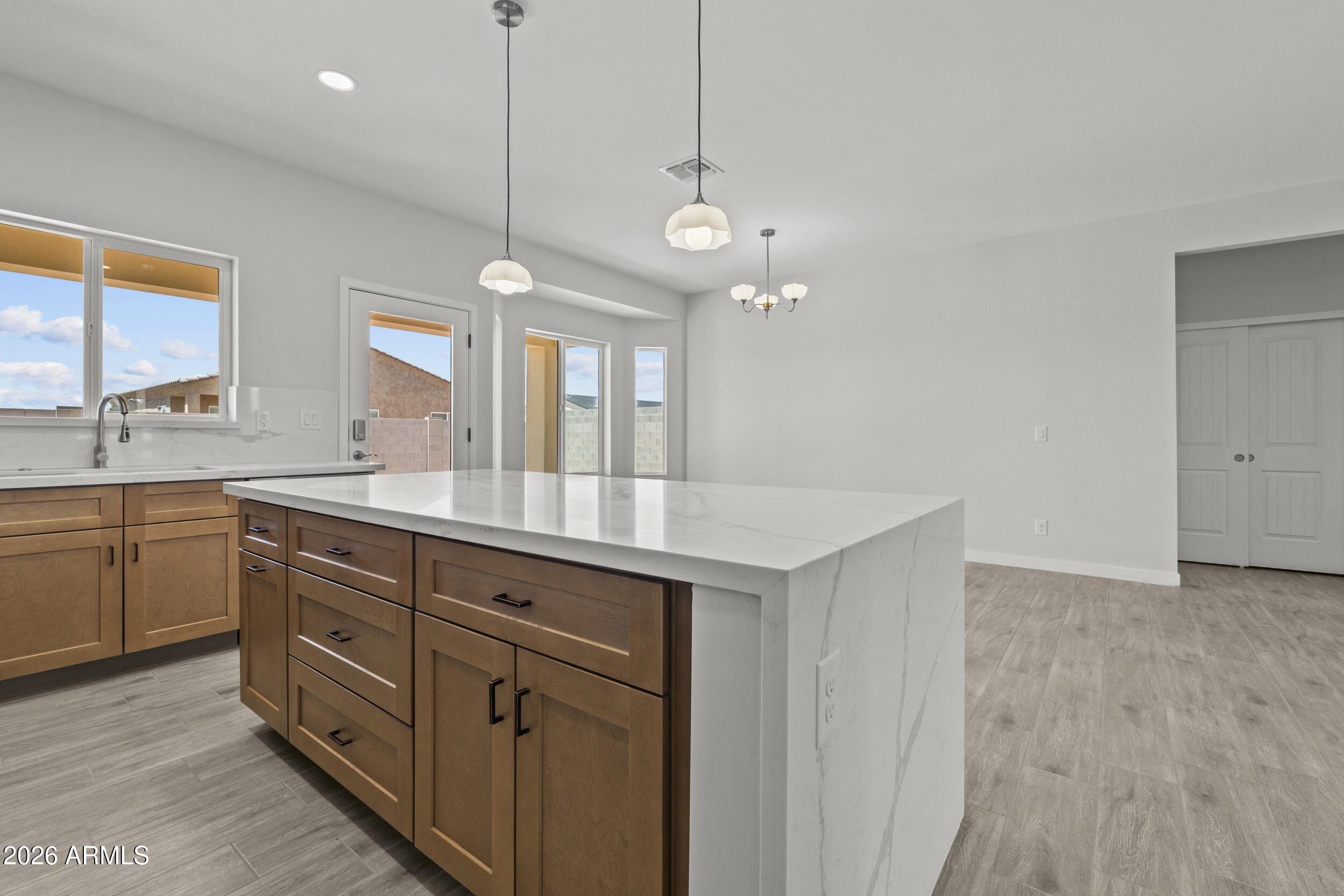 Discover the perfect blend of modern design and Arizona's open-space charm in this beautifully built new construction home in Arizona City. 

Inside, a bright, airy floor plan welcomes you with seamless flow for both everyday living and effortless entertaining. The kitchen impresses with sleek cabinetry, quality appliances, and stylish finishes, opening naturally to the main living space - the true heart of the home. 

Set on a generously sized lot, there's endless potential to create your dream outdoor retreat and unwind beneath breathtaking desert sunsets. 

Enjoy the ease of brand-new, low-maintenance living, ideally positioned between Phoenix and Tucson for quick access to city conveniences while savoring peaceful small-town living.

Seller Financing Option.