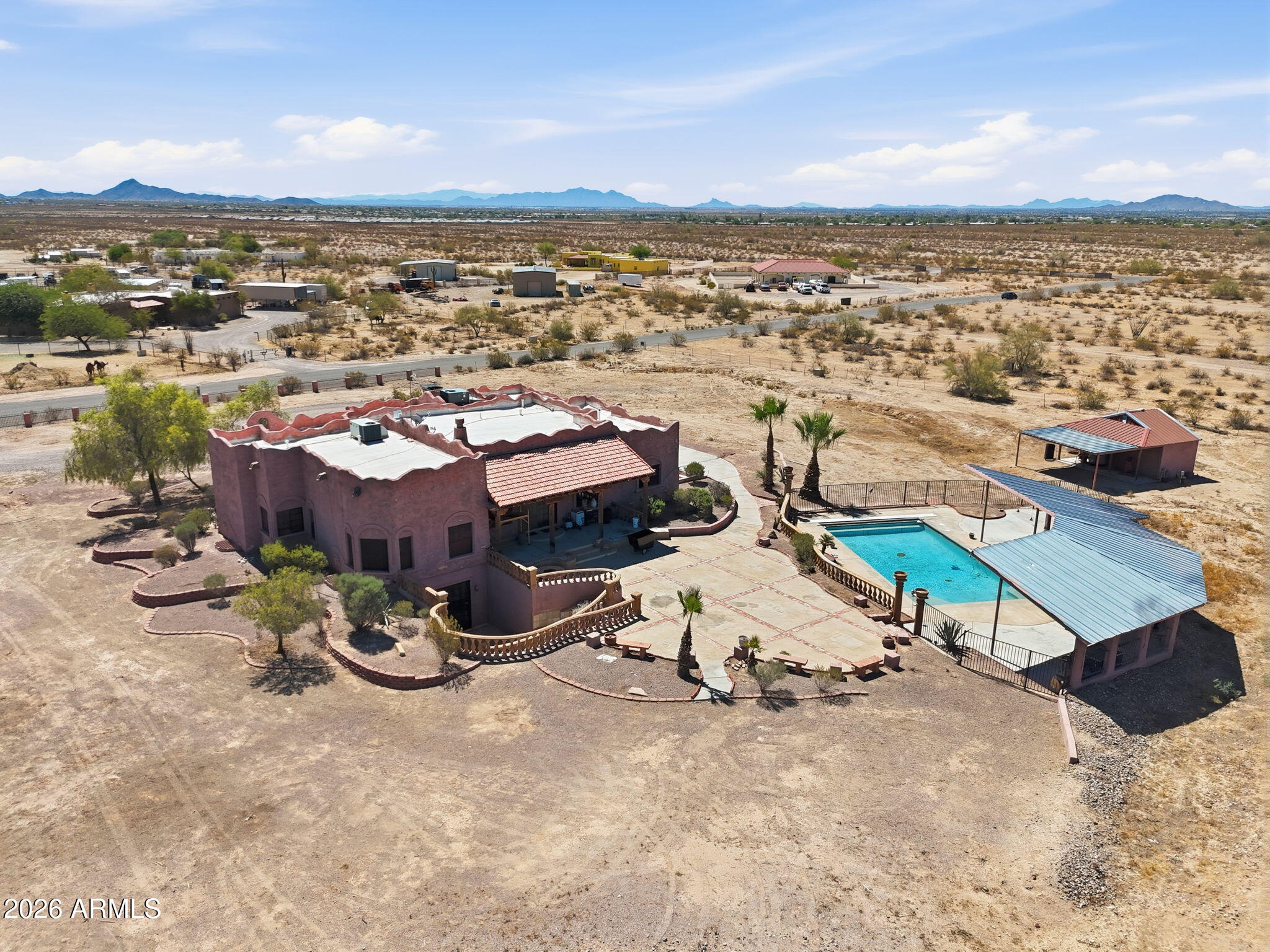 Welcome to your private Arizona retreat! This exceptional horse property offers space, privacy, and the perfect blend of comfort and Southwest charm. Situated on acreage, this unique home features an adobe-style design, spacious living areas, a finished basement for additional flexibility, and a large private pool perfect for enjoying Arizona sunsets. The property provides plenty of room for horses, RVs, toys, and outdoor activities. Enjoy the freedom of private well water, no HOA restrictions, and the serenity of your own desert estate. A rare opportunity to own a property with endless possibilities, whether you're looking for an equestrian setup, peaceful country living, or a private getaway close to amenities.