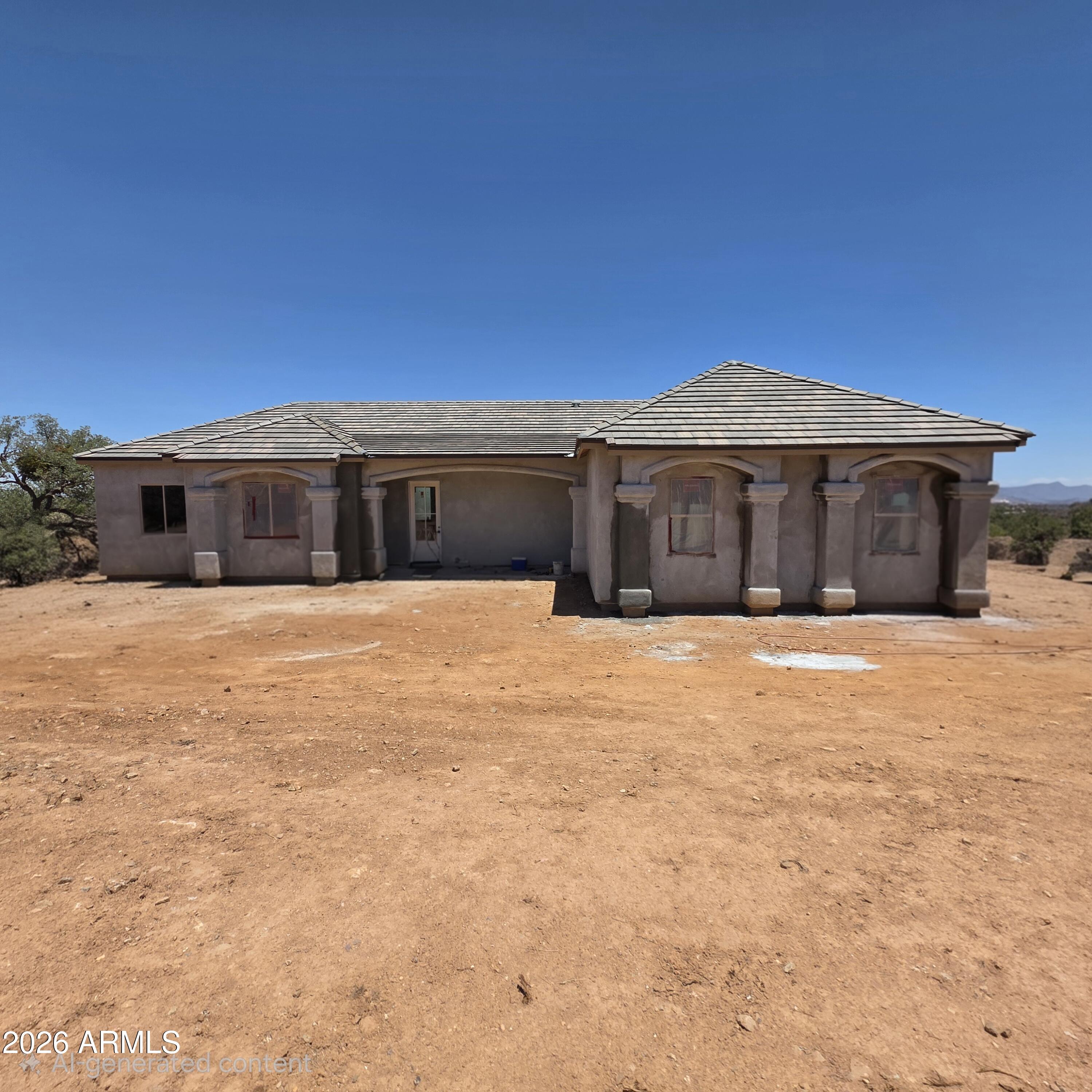 Located in the beautiful Wild Horse Subdivision, this stunning new construction home sits on a spacious 3.6-acre corner lot surrounded by breathtaking mountain views. Featuring 4 bedrooms, 2 bathrooms, and a 3-car garage, the thoughtfully designed open floor plan offers both comfort and functionality. Once completed, the home will showcase wood-look tile flooring throughout, custom cabinetry, and matching granite countertops, creating a seamless blend of style, a warm color palette and quality craftsmanship.