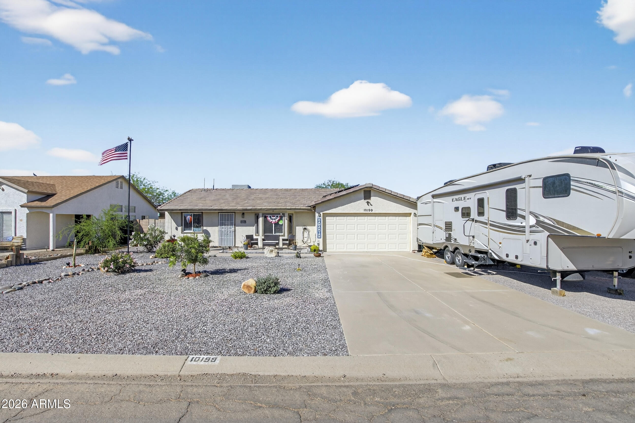 Move-in ready 3-bedroom, 2-bath home in Arizona City featuring a split floor plan, vaulted ceilings, and laminate and tile flooring throughout. Kitchen is nicely updated with white cabinets, quartz countertops, newer stainless steel appliances, and a walk-in pantry. Updated lighting, fans, and fixtures add to the home's fresh feel. Enjoy a large backyard with covered patio, storage shed, and space to make it your own. Dual pane windows, 2-car garage, 2024 roof, 2024 water heater, and VA assumable financing make this one stand out.