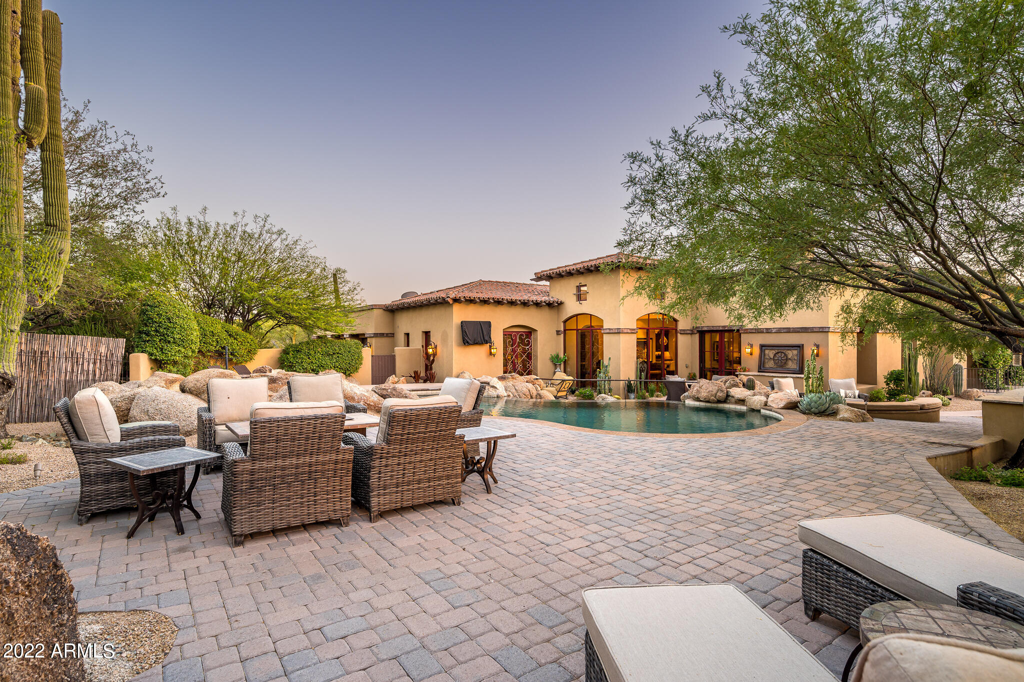 Elegant residence located in Whisper Rock Estates * Sited on a north-facing 1.28 acre lot, the home features an open floor plan with no interior steps and split primary retreat * Expansive outdoor living features multiple fire effects, outdoor kitchen, large covered patio, heated pool/spa and several boulder outcroppings * Entry courtyard with private guest casita, great room with adjoining kitchen, separate guest wing, wet bar serving both indoors & outdoors, and formal dining room with butler's area complete the estate * Custom finishes include natural stone & wood flooring, slab granite & marble counter tops, wood beamed ceilings & automated lighting & audio system * On-site amenities include fitness facility, heated lap pool & spa, tennis courts, pickle ball courts & lifestyle director