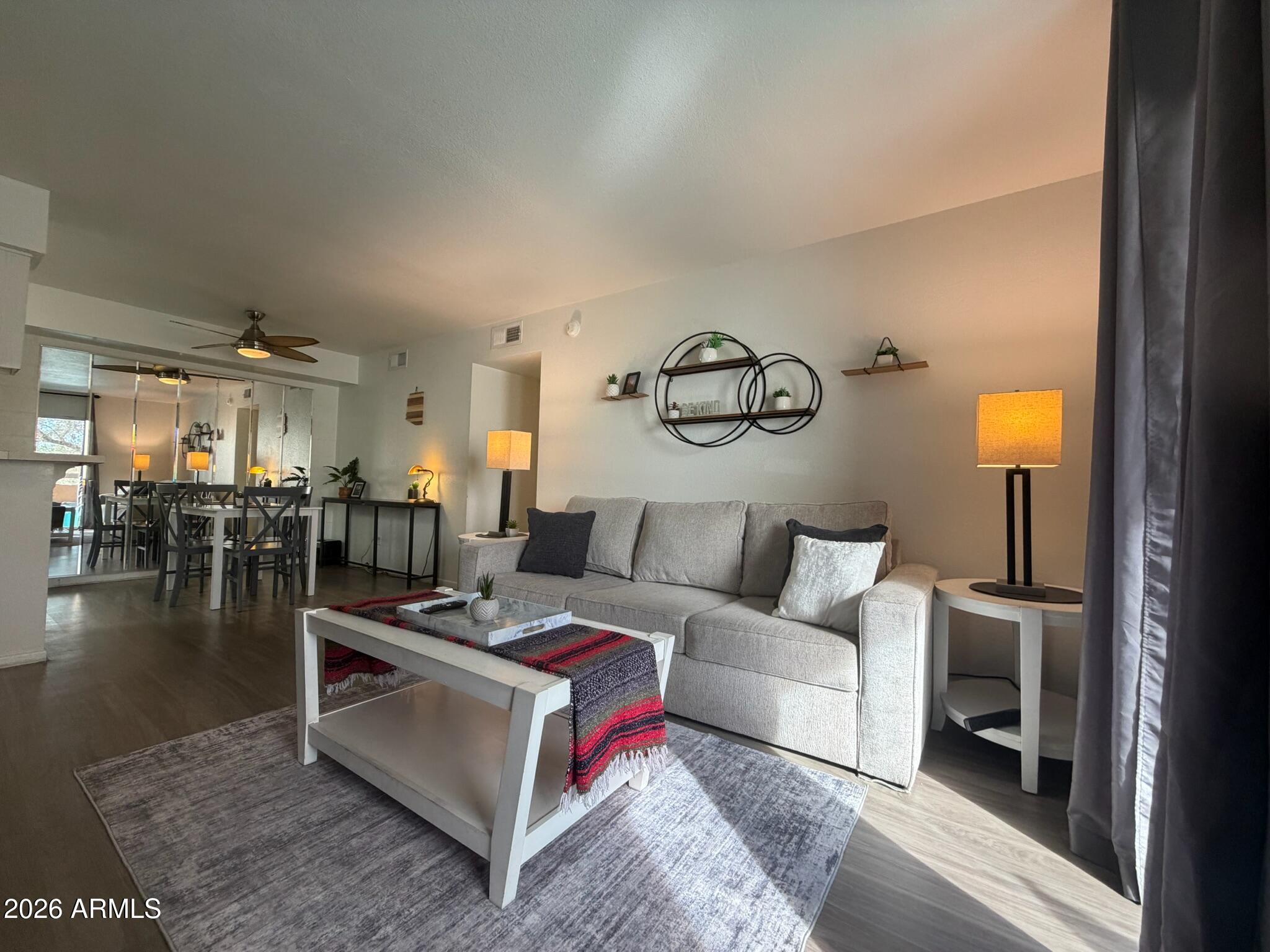 Pristine and perfectly located! This well-maintained 1-bed, 1-bath condo sits right in the heart of the vibrant Biltmore/Arcadia neighborhood, just steps away from countless restaurants and retail options.
Situated within a secure gated community, residents enjoy access to a heated pool/spa, gym, and putting green. The interior shines with modern luxury vinyl wood flooring and offers incredible value as a fully furnished unit.  Buyers can buy with confidence knowing the big-ticket items have already been upgraded, including a 3-year-old AC unit, newer washer/dryer, and a 1-year-old garbage disposal. Bathroom tub and tile surround recently replaced. Perfect for primary residents, winter visitors, or investors alike!
