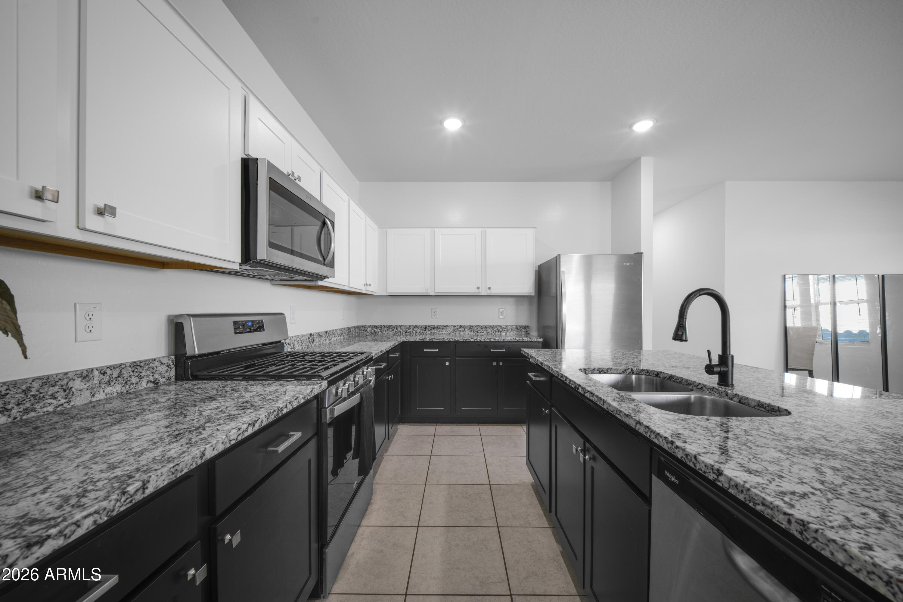 Welcome home to this beautiful, move-in-ready single-story residence in the heart of Laveen! Boasting a highly desirable open-concept floor plan, this 4-bedroom, 3-bathroom home offers the perfect blend of comfort and style. The spacious kitchen flows seamlessly into the main living area, making it ideal for entertaining family and friends. Relax in the private primary suite featuring a generous walk-in closet and en-suite bath. Step outside to a low-maintenance backyard blank canvas ready for your personal touch. Located in a fantastic community featuring pristine greenbelts and neighborhood parks, with quick access to the Loop 202, local dining, and shopping. Don't miss this Laveen gem!