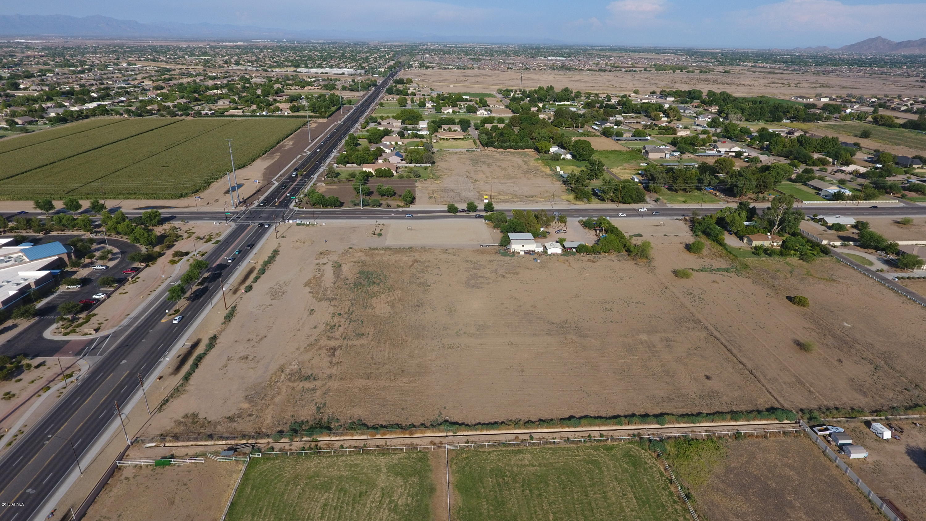 Hard corner in Gilbert! 10.5 acres!  Southwest corner with residential zoning (SF-35) an old Conditional Use Permit (Maricopa County) for Senior Living / Assisted Living!  Cheapest corner for sale in Gilbert or Chandler!  Perfect for your developer clients.  Just two miles south of the Loop 202, a mile and a half south of Gilbert Mercy hospital, 2.5 miles south of the Santan Village Mall, 2 miles from the LDS Temple, walking distance to schools and parks!  Two of the top rated high schools in Arizona!  There is a home and shop on the property that could be leased for monthly income!  Over $550,000 in off-site work is in and complete!