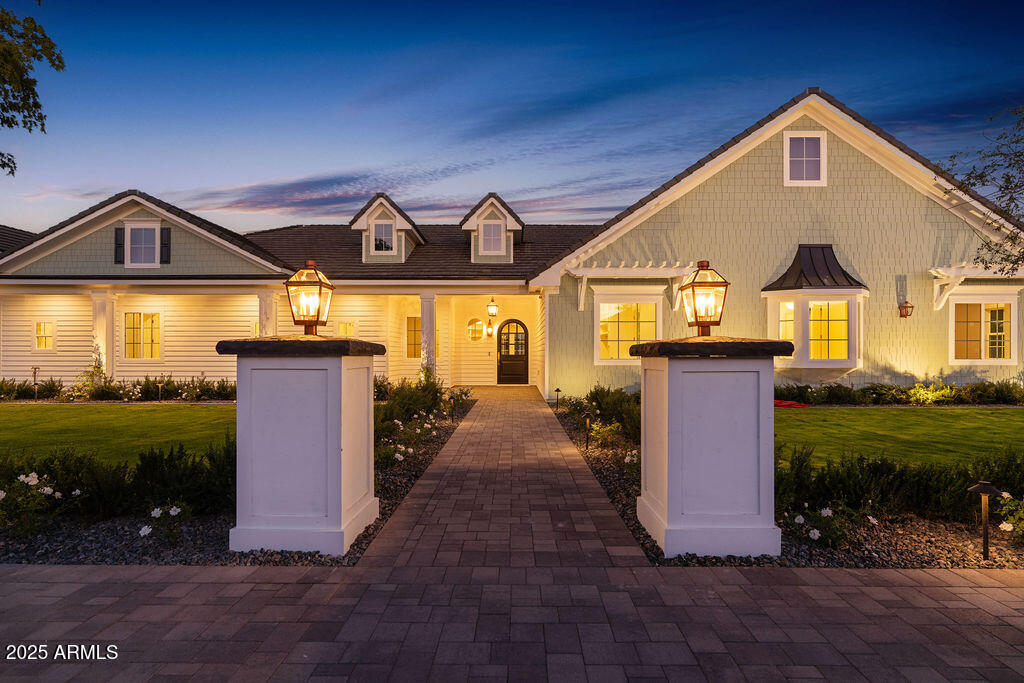 Step inside this luxurious, fully custom cottage-core new build: 4 bed, 3.5 bath, 4,172 sqft wrapped head-to-toe in James Hardie Artisan concrete board siding on a 43,223 sqft fully landscaped lot with mature citrus trees. Pre-wired Cox Wi-Fi, Netgear data ports, Wi-Fi boosters included. Built-in 8K security cameras.
An arched black solid-wood door opens to a checkered gray/white tile foyer with an oval window. Great room with 10-ft ceilings, 6 channel surround sound, marble fireplace, two built-in shelves, and natural light pouring in from floor-to-ceiling glass doors that open to the integrated kitchen: quartz double islands, recessed lighting, ivory custom cabinetry, ILVE 48" range + hood, Sub-Zero fridge/freezer, Scotsman pebble ice, Wolf drawer microwave, prep sink, reverse osmosis, two Cove dishwashers on each side of the oversized main sink in front of a large window. Cozy table nook crowned by a gorgeous chandelier.  Double doors lead to a sage-green prep kitchen/walk-in pantry: Wolf convection steam oven, beverage fridge, deep sink in front of a large window, prep counter, and ample cabinet space.

Primary suite: dedicated thermostat (one in each bedroom), patio access, 5-channel surround sound.

Primary bath: freestanding tub beneath a chandelier, glass shower with bench + 3 heads + digital thermostat/controls, dual vanity with makeup station, and private toilet room.
His closet: bluish-gray custom cabinetry, shoe wall, quartz counters, built-in laundry hampers.
Her closet: built-in bench under a massive window, ivory custom cabinetry, shoe wall, quartz counters, built-in laundry hampers.

Bedroom 2: walk-in closet, en-suite bath with digital thermostat/controls, frosted window.

Bedrooms 3 & 4: large windows, recessed closets. Baby-blue Jack-and-Jill bath with split vanity + tub/shower.

Laundry/mudroom: utility sink, quartz counter over washer/dryer, floor-to-ceiling cubbies, abundant cabinet space.

4-car garage: epoxy floors, ceiling speakers, security cameras, large windows for natural light, and an attached flex room (office/storage).

Backyard: covered patio with fireplace, dual fans, ceiling speakers, private pool/spa, citrus tree perimeter, built-in grill station with gas stove, grill, True mini fridge, sink, and counter space. RV gate with space for future garage/casita.