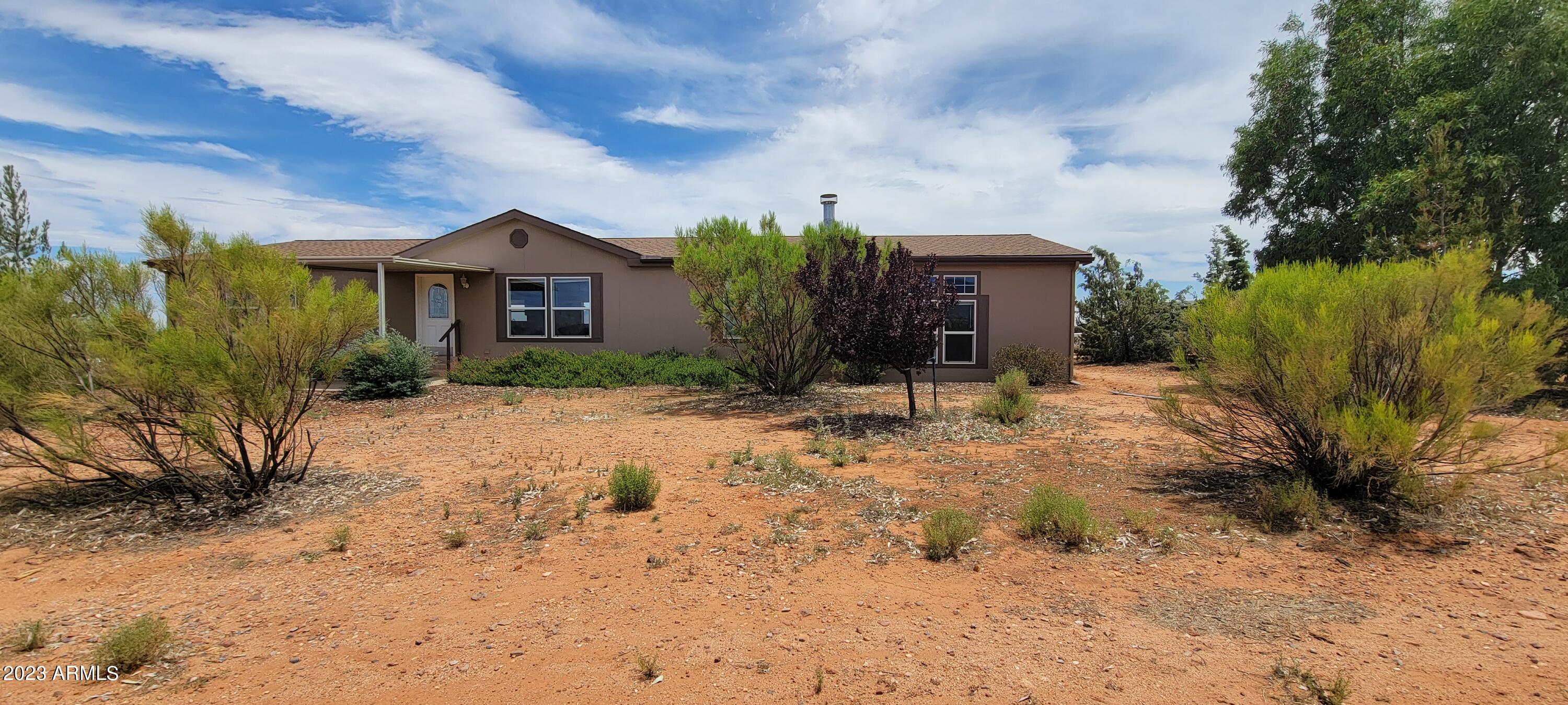 Are looking for HORSE PROPERTY that also has a beautiful home? Look no further! This property has it all. Amazing mountain views, it is fully fenced, barn, and more. The home has been lovingly updated with new vinyl plank flooring, gorgeous kitchen with and island and tons of cabinetry and counter space and an open floor plan. The master suite is split and has wonderful mountain views. The master bath boasts a garden tub with a separate shower, dual sinks and other custom upgrades. On the opposite side of the home there are 3 large bedrooms, another full bath and the laundry room. You will also love the step down family room with real fireplace. There is so much to love about this special home! Call today for your private showing.