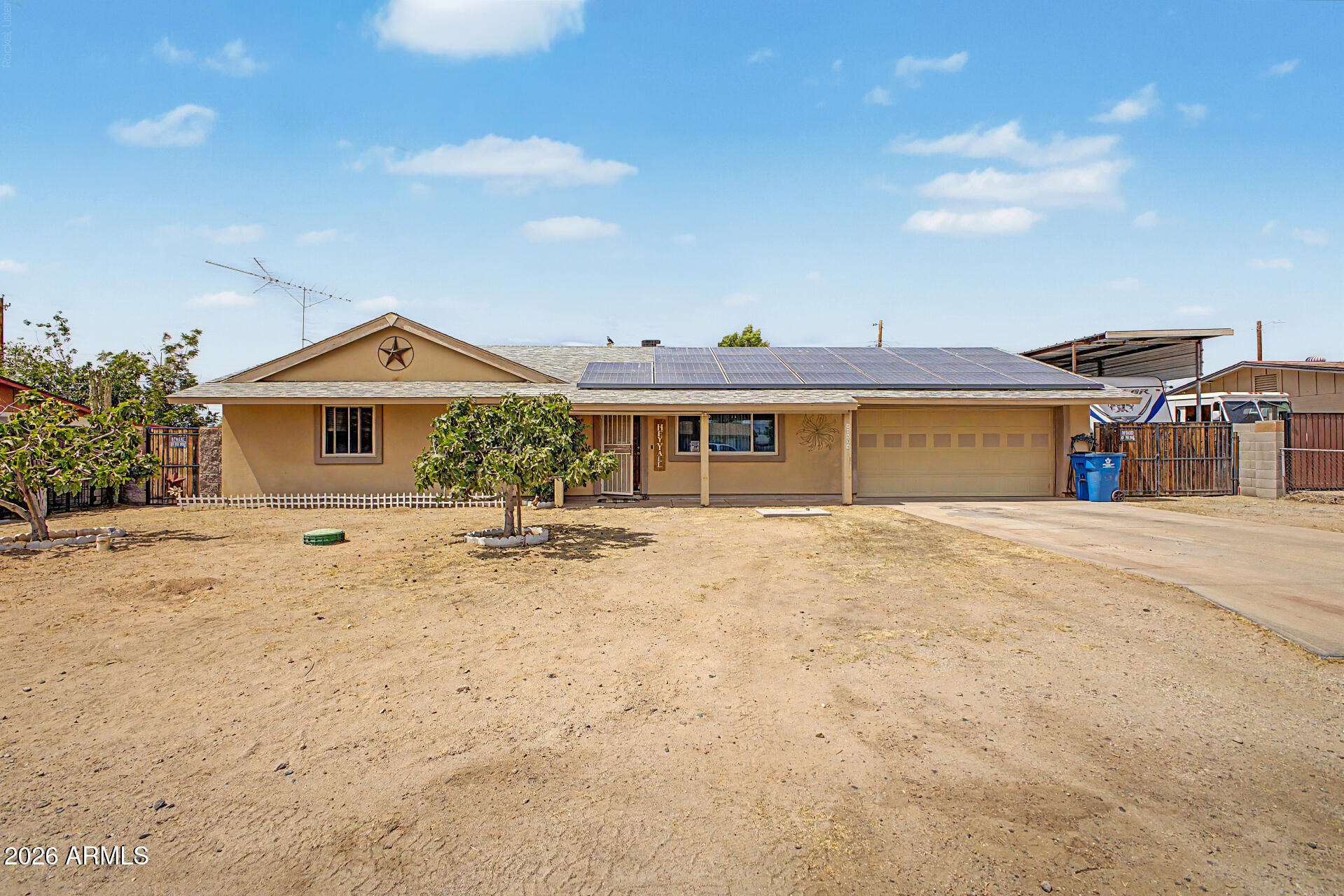 Welcome to this charming home in Sundown! This energy-efficient, 3-bedroom residence is on a spacious cul-de-sac lot, featuring an attached garage, RV gate, and a generous front yard. Step inside to a bright, open layout complemented by warm-toned paint and Saltillo tile flooring. The galley kitchen is equipped with ample storage, stainless steel appliances, and granite countertops. The primary bedroom offers a full bathroom for added privacy & comfort. The backyard oasis has a covered patio and a sparkling pool with a seating area around the edge for sunbathing. This wonderful home has it all, yet provides an opportunity to add your personal touch! Enjoy a quiet neighborhood with fabulous views of Superstition Mountain and vibrant, colorful sunsets. Don't miss this amazing property!
