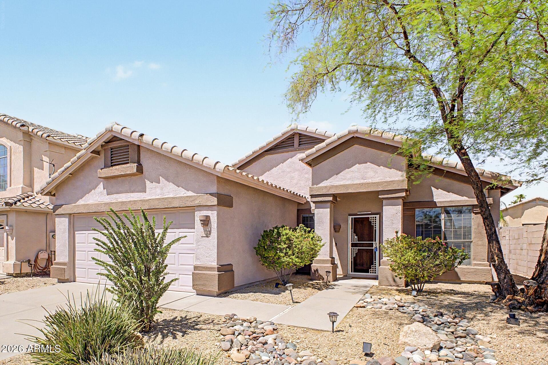 Beautifully updated single-level 4-bedroom, 2-bath home nestled near the scenic Cave Buttes Recreation Area in North Phoenix. This desirable split floor plan offers an open-concept living space with vaulted ceilings, wood-look tile flooring, and abundant natural light. The remodeled kitchen features white cabinetry, granite countertops, stainless steel appliances, a large center island, and overlooks the spacious family room--perfect for entertaining. The private primary suite includes a walk-in closet and separate tub and shower. Enjoy a low-maintenance backyard with artificial turf, a covered patio and North/South exposure. Conveniently located near Desert Ridge Marketplace, top-rated schools, hiking trails, golf, shopping, dining, and easy access to Loop 101 and SR-51. Welcome Home!!!