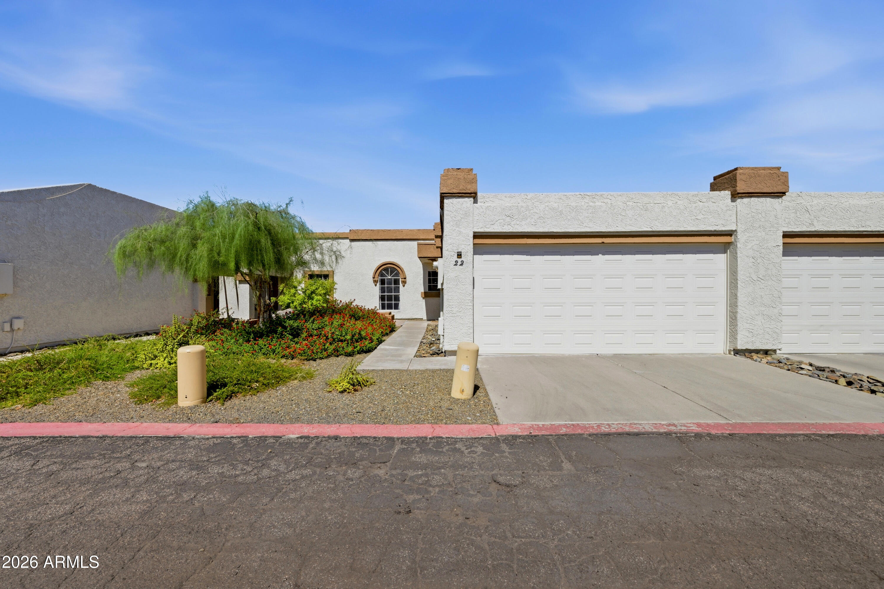 Rare opportunity to own a beautifully updated single-story patio home in an unbeatable location! This inviting home features wood-look laminate and tile flooring, a light neutral palette, skylights, and a versatile bonus room perfect as an office, den, or 3rd bedroom with sliding doors to the backyard. The kitchen offers SS appliances, updated hardware, a dual-basin sink, & copper tile backsplash. The spacious primary suite includes a custom closet, dual sinks, and a tiled walk-in shower, while the guest bedroom is highlighted by a beautiful arched window that adds timeless character. Enjoy a private backyard with pavers, artificial turf, a heated spa, & direct access to the greenbelt and community pool. Just 10 minutes to Downtown Gilbert, 15 minutes to ASU, and 20 minutes to Sky Harbor.