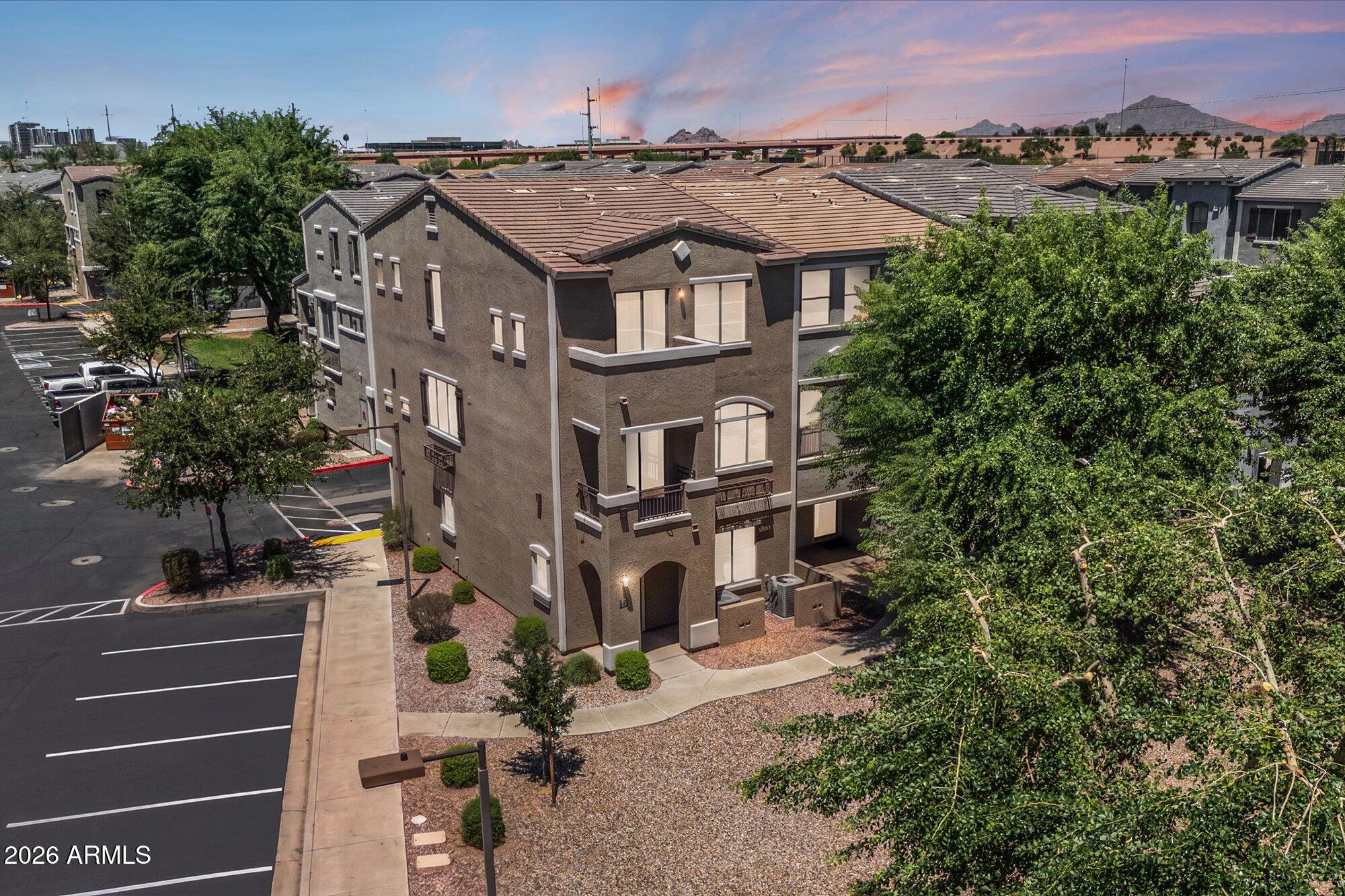 Discover one of the largest residences in Villagio at Tempe. This expansive 4-bedroom corner-unit townhome offers the largest floor plan in the complex with an exceptional three-level layout. Designed for comfort and flexibility, the home features two primary suites and a first-floor junior suite, making it ideal for guests or multigenerational living, along with an open-concept main living area. The kitchen is equipped with stainless steel appliances, and the home includes a Whirlpool washer and dryer. Enjoy the convenience of a 2-car garage with built-in cabinets for additional storage, plus two permitted parking spaces. A rare opportunity to own one of the community's largest and most functional floor plans in a prime Tempe location!