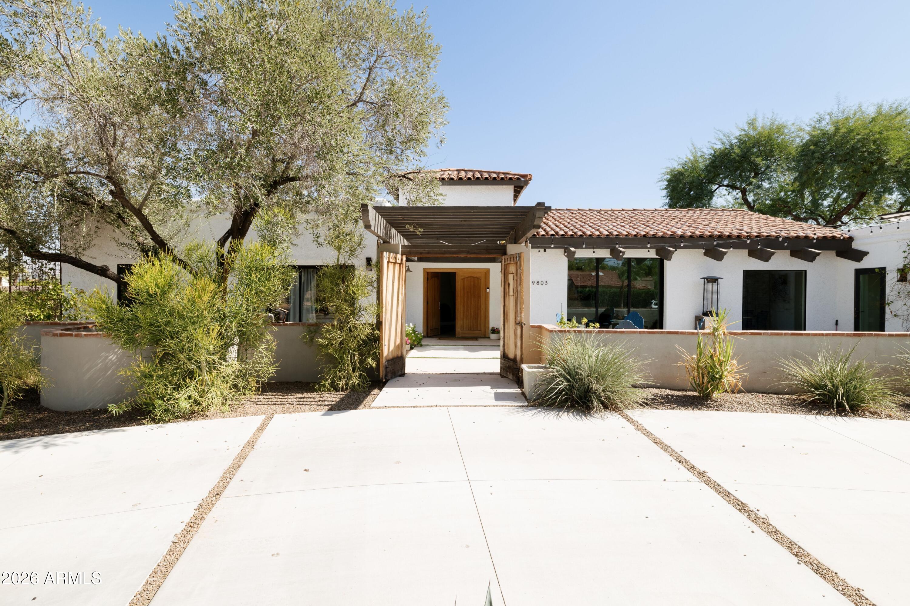 Welcome to an exceptional residence in prestigious Chaparral Estates, nestled in Paradise Valley. This beautifully remodeled estate seamlessly blends timeless elegance with modern luxury, offering a total of 3,849 square feet between the main residence and a newly completed guest house.
The 3,194 sq ft main home, thoughtfully updated in 2018, features 4 bedrooms and 3 full bathrooms. With a charming front courtyard, magical backyard and state of the art kitchen, this home is a rare gem.
The chef's kitchen is a true centerpiece, appointed with premium stainless-steel appliances including a Sub-Zero refrigerator and Wolf gas range, complemented by a stylish coffee bar, expansive island, built-in dining area, and abundant storage. A charming wood-burning fireplace anchors the kitchen (CONT' creating warmth and ambiance.
The formal dining room is ideally situated just off the kitchen with a nano-wall slider with access to the front courtyard and firepit, perfect for hosting elegant gatherings.
The primary suite is a serene retreat with its own private entrance, two generous walk-in closets, and spa-inspired en-suite bath featuring a double vanity and luxurious walk-in rainfall shower.
A second primary suite offer a modern en-suite bath and oversized walk-in closet, while two additional bedrooms are positioned on the opposite wing alongside a full bathroom, generous mudroom/laundry area, and a versatile pantry or office space.
Nestled around the large canopy of a mesquite tree, the newly constructed 655 sq ft guest house provides an elevated experience for visitors, complete with a bedroom, bathroom, living area, and kitchenette--ideal for outdoor parties, a pool cabana, extended stays or private accommodations.
Step outside to your own private paradise. A spacious covered patio overlooks a sparkling diving pool, while the expansive yard offers ample room for recreation, pets, gardening and entertaining.
Enjoy the built-in BBQ and Caja China, outdoor shower just off the guest house and under tree canopy, mature landscaping, abundant citrus and stunning mountain backdrop that defines luxury desert living.
This is a rare opportunity to own a refined and private retreat in one of Arizona's most coveted enclaves, with easy access to the entire valley in a true neighborhood.