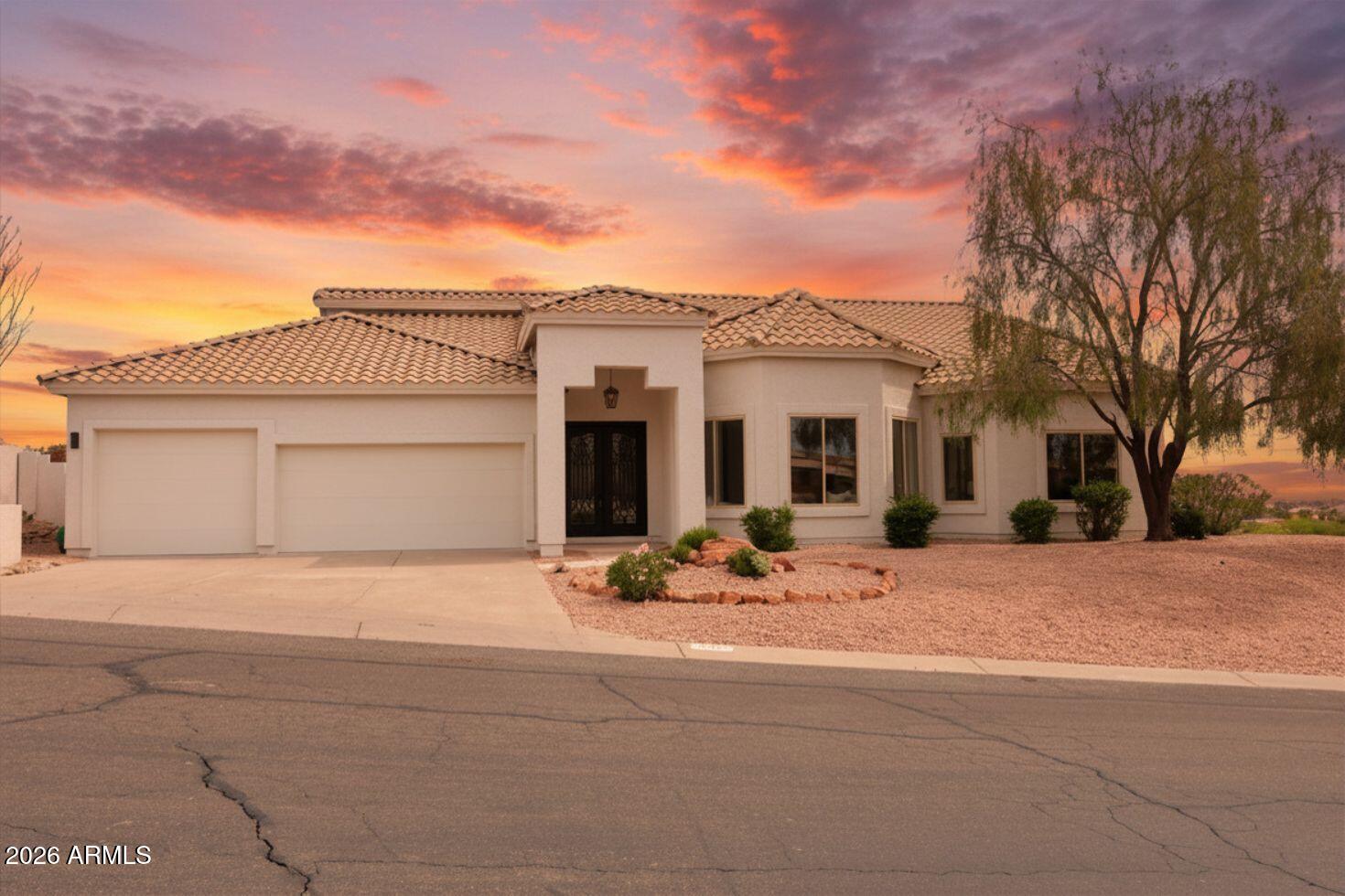 Beautifully redesigned and fully upgraded, this stunning residence showcases the work of a professional interior designer and is set against breathtaking mountain views. Recent improvements include a new roof, front door, patio doors, interior doors, flooring, custom cabinetry, and more-offering peace of mind and true move-in-ready convenience. This spacious 3-bedroom + den, 2.5-bath home seamlessly blends timeless comfort with modern elegance. The thoughtfully updated interior features high-end finishes, beautifully remodeled bathrooms, and a striking powder room with premium fixtures. Step outside to a tranquil backyard retreat, complete with newly installed turf, a covered patio, and low-maintenance desert landscaping--perfectly positioned to enjoy Arizona's spectacular sunsets. A rare opportunity to own a fully upgraded home with exceptional design and lasting value--this one won't last.