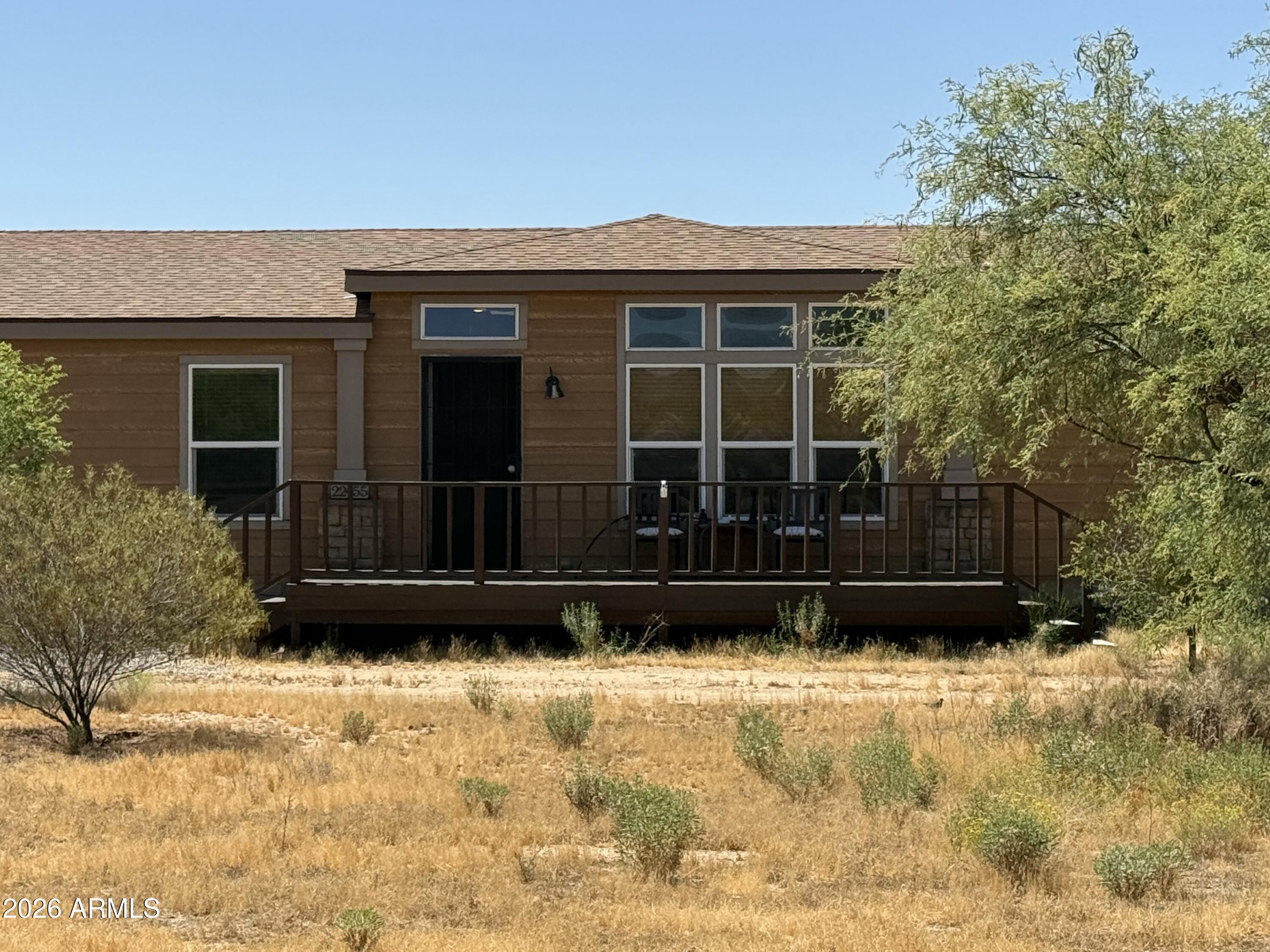 Welcome to your slice of Arizona living in the heart of Congress! This spacious 4-bedroom, 2-bathroom home offers 2,280 square feet of comfortable living space, perfectly situated on just over an acre - giving you room to spread out, relax, and enjoy the surrounding desert beauty. Step inside to discover a thoughtfully designed layout with generous living areas and abundant natural light. The primary suite is a true retreat, featuring a large en-suite bathroom complete with a separate shower and a luxurious soaking tub - perfect for unwinding at the end of the day. This home is built with efficiency in mind, boasting Energy Star windows and a Green Energy Home Certification, helping keep utility costs down while maintaining year-round comfort. Outside, the property continues to impress with a 2-car garage, a versatile workshop ideal for hobbies or storage, heated spa, and covered patios perfect for enjoying Arizona's stunning sunsets. The pipe/no-climb fenced backyard provides privacy and space for pets, gardening, or entertaining. Brand new roof 2023 and the Heater/AC units were replaced in 2022! If you're looking for space, efficiency, and small-town charm all in one, this Congress property is ready to welcome you home.