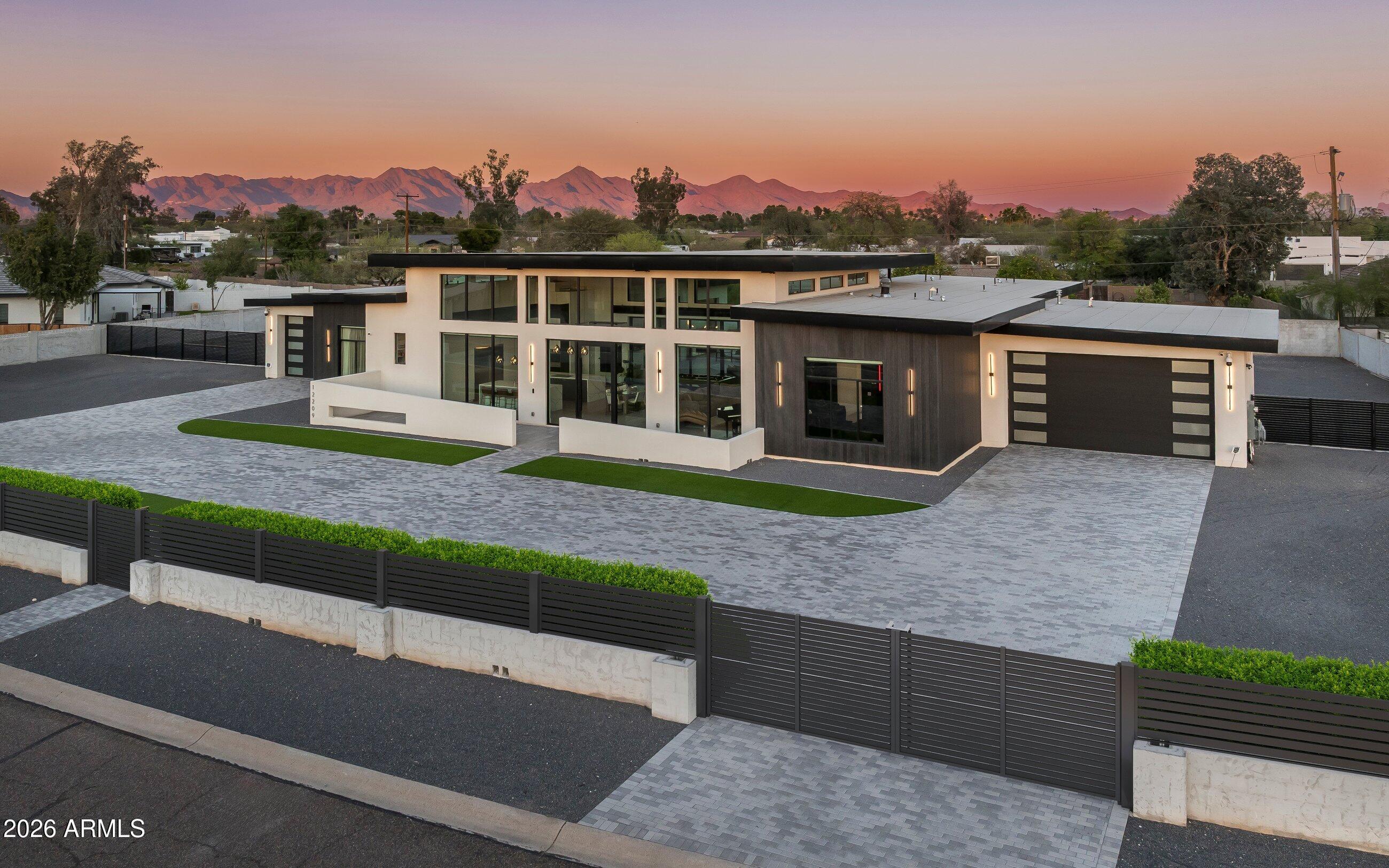 Built in 2023 and enhanced with extensive upgrades, this modern yet inviting residence sits on just under an acre and features a desirable split floor plan with two versatile flex rooms. The chef's kitchen is equipped with Wolf and Sub-Zero appliances, while a full Control4 smart home system provides seamless automation of shades, lighting, audio, security, and climate throughout the home.

The resort-style backyard is designed for entertaining with a heated pool and spa, separate pool bath with convenient exterior access, a pergola with misters and a built-in grill, and a pool bar tucked behind a garage door for effortless indoor/outdoor living. An oversized 4-car garage offers ample storage, while the expansive lot provides room to add an RV garage, guest house, or pickleball court.
