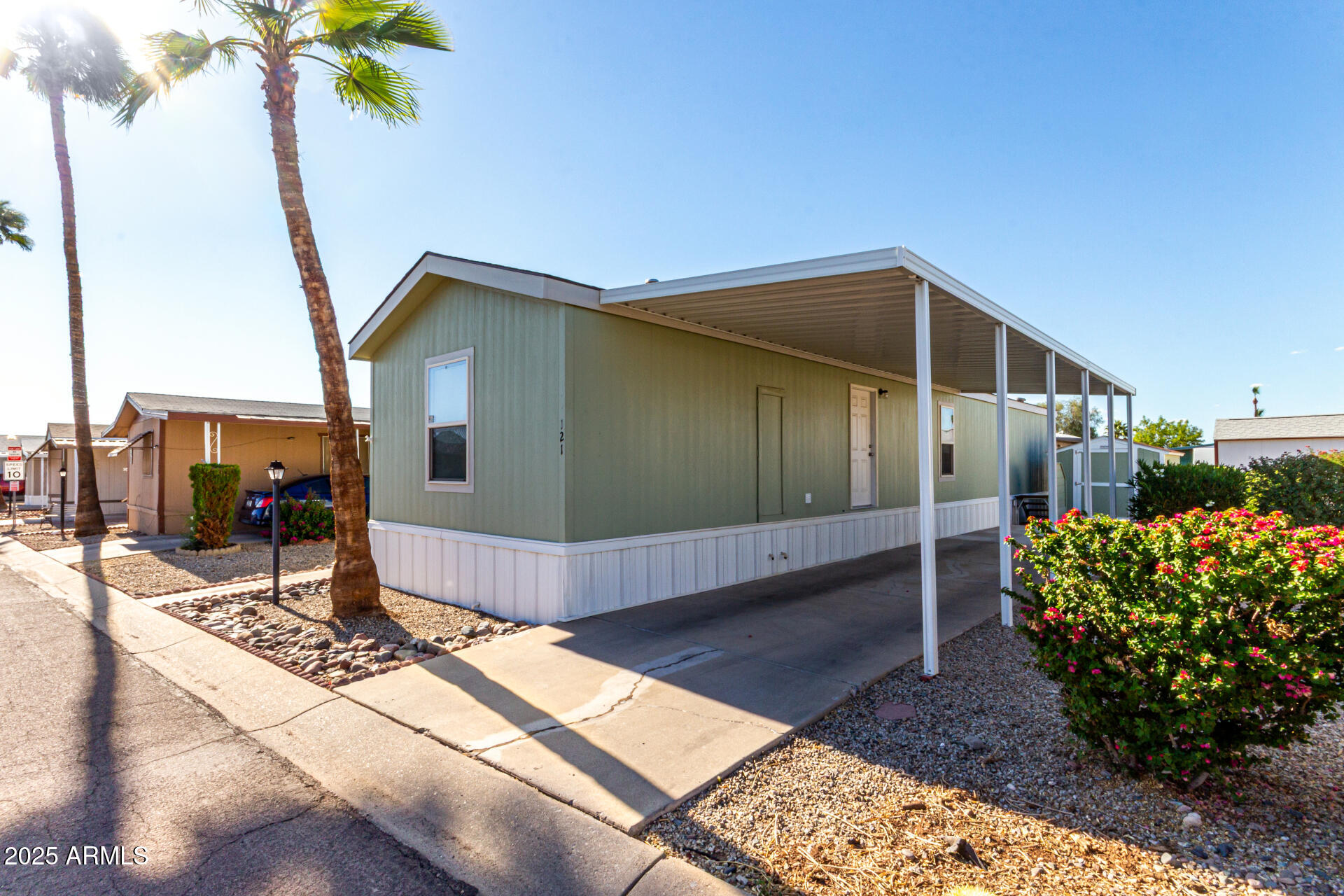 NOT AGE RESTRICTED - Affordable Living in Peoria!  Absolutely Beautiful 2 Bedroom, 2 Bathroom, Mobile Home Located in Suncrest Family Mobile Home Park, BUILT in 2018, Open Kitchen w/Gas Range & Oven, Kitchen Island w/Breakfast Bar, Eat-In Kitchen Dining, Spacious Greatroom w/Vaulted Ceilings, Master Bedroom w/Walk-In Closet & Ensuite Master Bathroom, 2 Car Carport, Community Clubhouse & Swimming Pool, Come Check It Out!