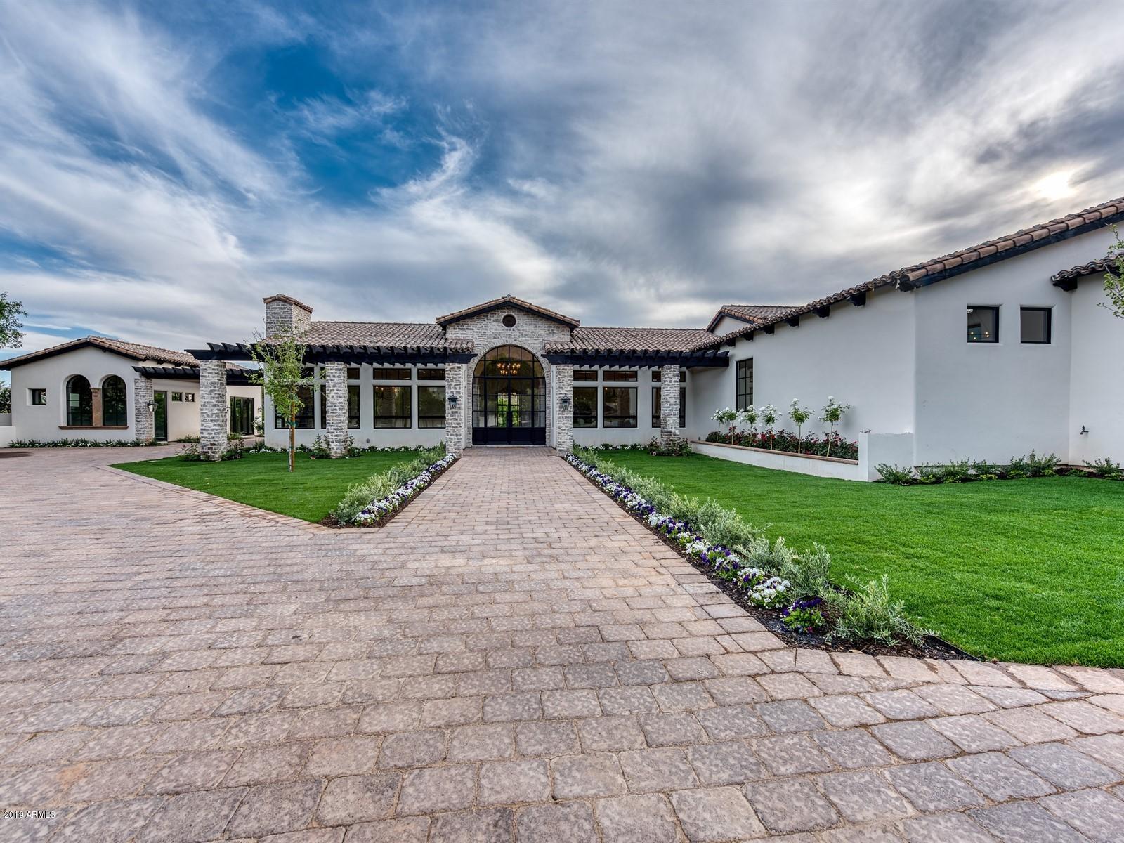 STUNNING Camelback views from this new GATED single level Arcadia Estate. 6,998 sf Main House with a 1,028 sf Guest in Arcadia's exclusive Gated enclave of 5 Homes. Beyond the gates, through the lush landscaping down the private paver road in the cul-de-sac is Arcadia's newest estate with Iconic Camelback Mountain Views. The home features: a Magazine worthy Double Island Kitchen with separate Prep Kitchen, Subzero/Wolf appliances, His & Hers Enormous closets, Romantic bathtub and private courtyard, steam shower, breakfast bar, Entertainment Room with Retractable Glass Wall, Wrap around paver driveway with Motor-court, 9 Car Parking lot, two separate spacious yards, Marble and European Oak Floors, Kids Teen Room and a Private Walking path that connects to Arcadia Proper. Timeless & Elegant!