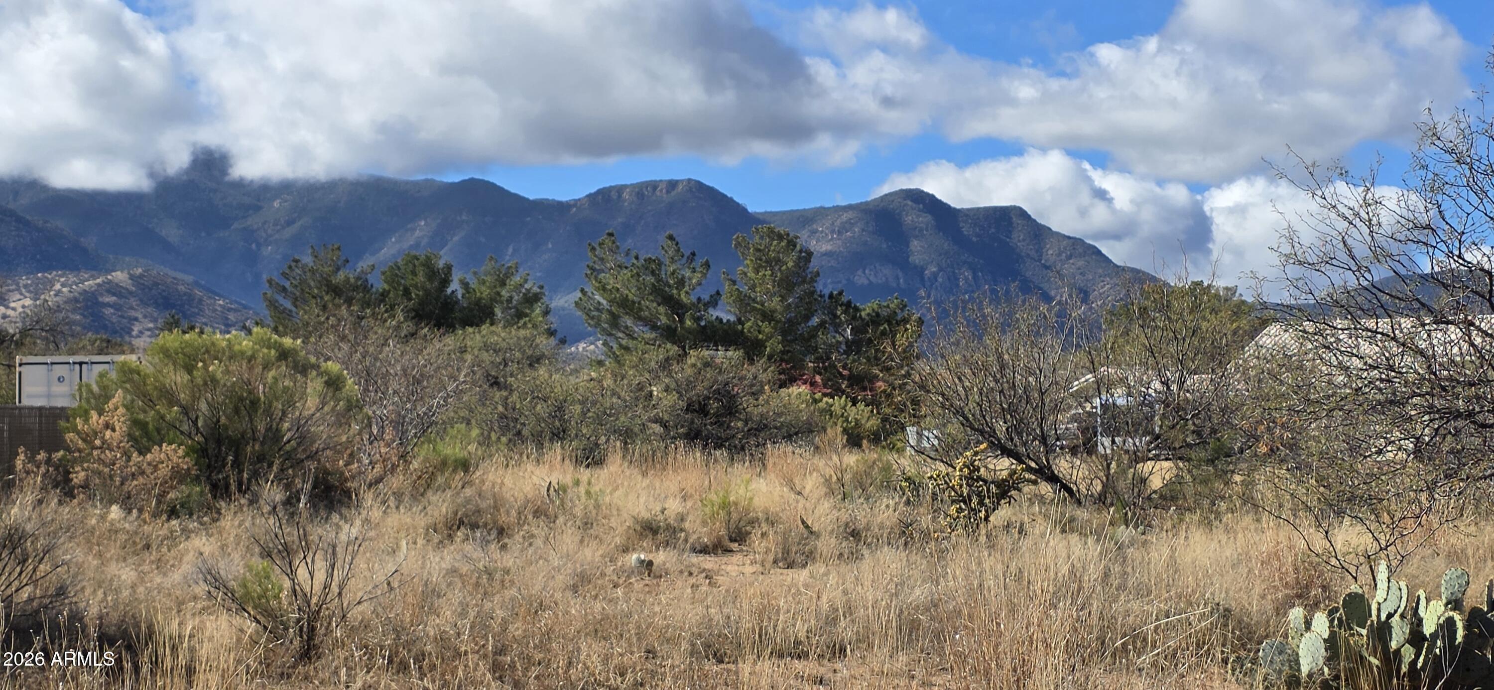 A one acre parcel located in an upscale neighborhood. The land is level and offers amazing mountain views. Located minutes from the heart of Sierra Vista, yet it offers a peaceful, rural energy. Utilities close to property line. Perfect for your site-built home. Buyer to verify all facts and figures.