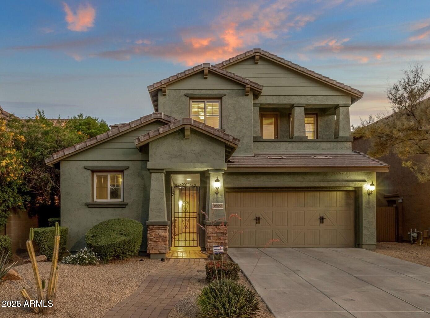 Located in the sought-after community of Fireside at Desert Ridge, this popular ''Colima'' floor plan boasts soaring ceilings, expansive living spaces, and timeless finishes throughout. Anchoring the home, the dramatic great room features two-story ceilings, a cozy gas fireplace, and custom built-ins. The open kitchen is appointed with an oversized granite island with breakfast bar, stainless steel appliances, abundant cabinetry, and a walk-in pantry. A downstairs den/office is perfect for working from home, providing privacy and functionality. Upstairs, a spacious loft offers flexible living space, ideal for movie nights, a play area, or a fitness room. The primary suite offers a spa-inspired bath with a soaking tub, walk-in shower, dual vanities with a separate makeup vanity, and an oversized closet. Outdoors, a private courtyard welcomes guests, while the backyard features a covered patio with a built-in grill, low-maintenance synthetic turf, and a gas firepit. Residents of Fireside enjoy access to one of North Phoenix's premier community amenity centers, featuring resort-style pools, a fitness center, tennis courts, walking trails, and more. Conveniently located near Desert Ridge Marketplace, CityNorth, top-rated golf, upscale dining/shopping, and major employers including Mayo Clinic and the Loop 101 corridor, and just minutes from Fireside Elementary, one of Arizona's highest-rated schools, this home delivers an exceptional blend of luxury, accessibility, and lifestyle.