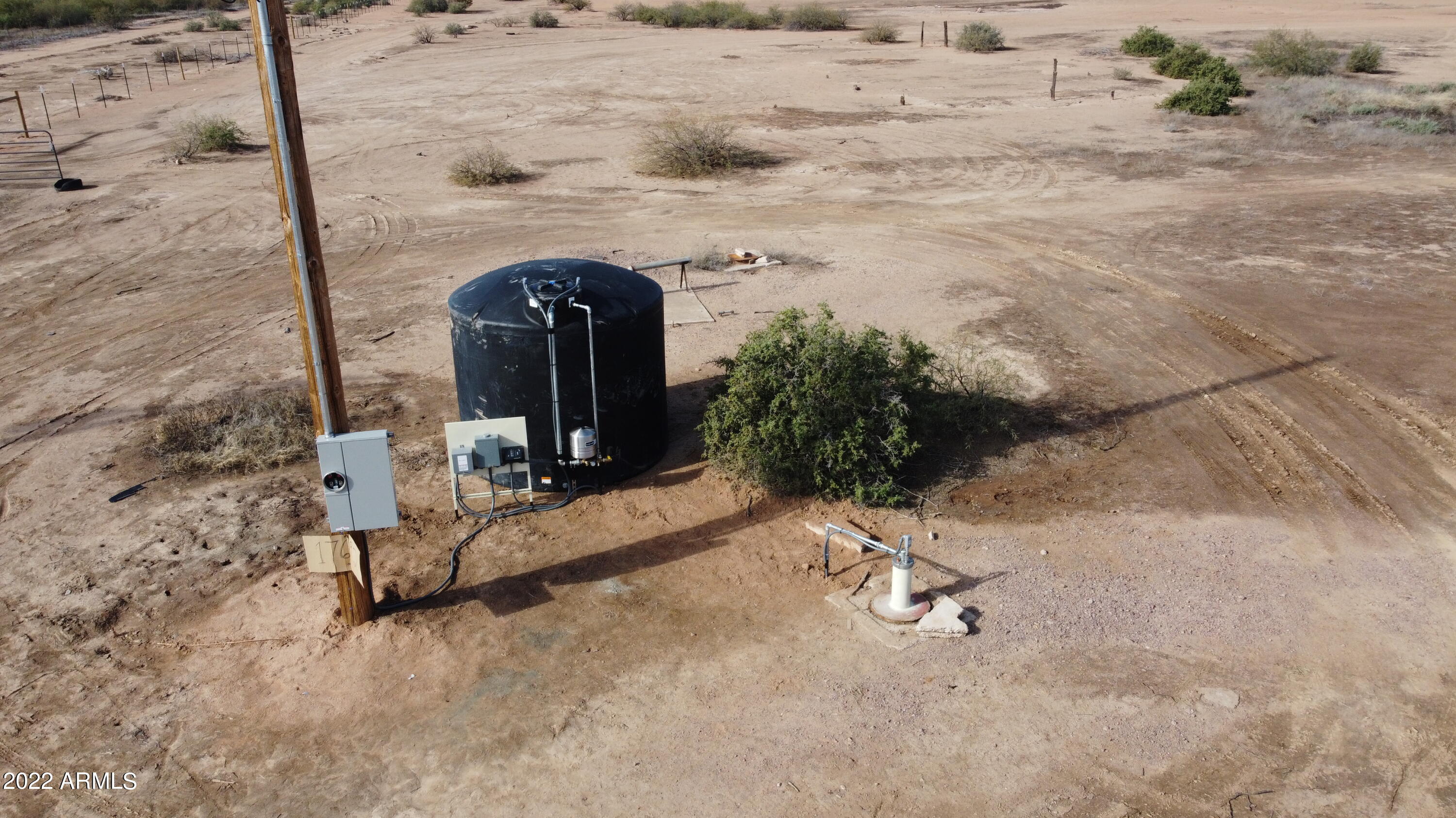 Great property 25 acres fully fenced with water well with 2,500-Gallon storage tank and electricity on the property. Flat land with paved road access. Property lies in the new Freeway 11 corridor. Great potential for 25 acres on intersection of two major roads (Battaglia and Chuichu). Have your own ranch or split into smaller home sites. Property contains parcels 511-80-013A, 511-80-013B, 511-80-013E,.