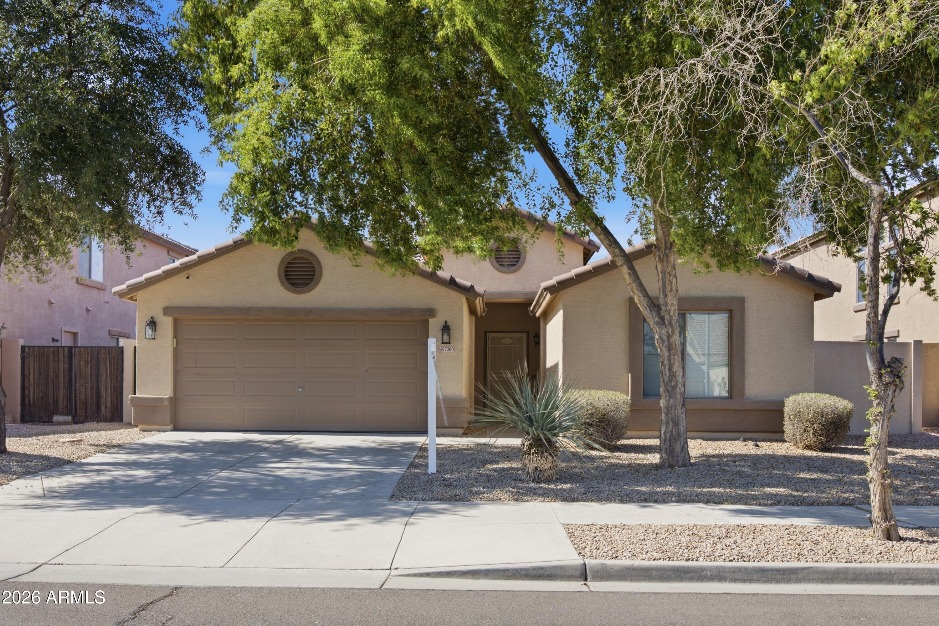 Welcome home to this move-in ready 3-bedroom + den property offering the perfect blend of comfort, functionality, and location. The open floor plan features spacious living areas, vaulted ceilings, a bright kitchen with stainless steel appliances, and a flexible den that can easily serve as a home office or 4th bedroom. The private backyard is designed for easy Arizona living with a covered patio, pavers, and artificial turf. Situated in the heart of Goodyear's booming growth corridor, you'll enjoy convenient access to shopping, dining, entertainment, major freeways, and the city's exciting new downtown district, GSQ. With continued investment, new businesses, and amenities arriving throughout the area, this home offers both a great lifestyle and long-term value.