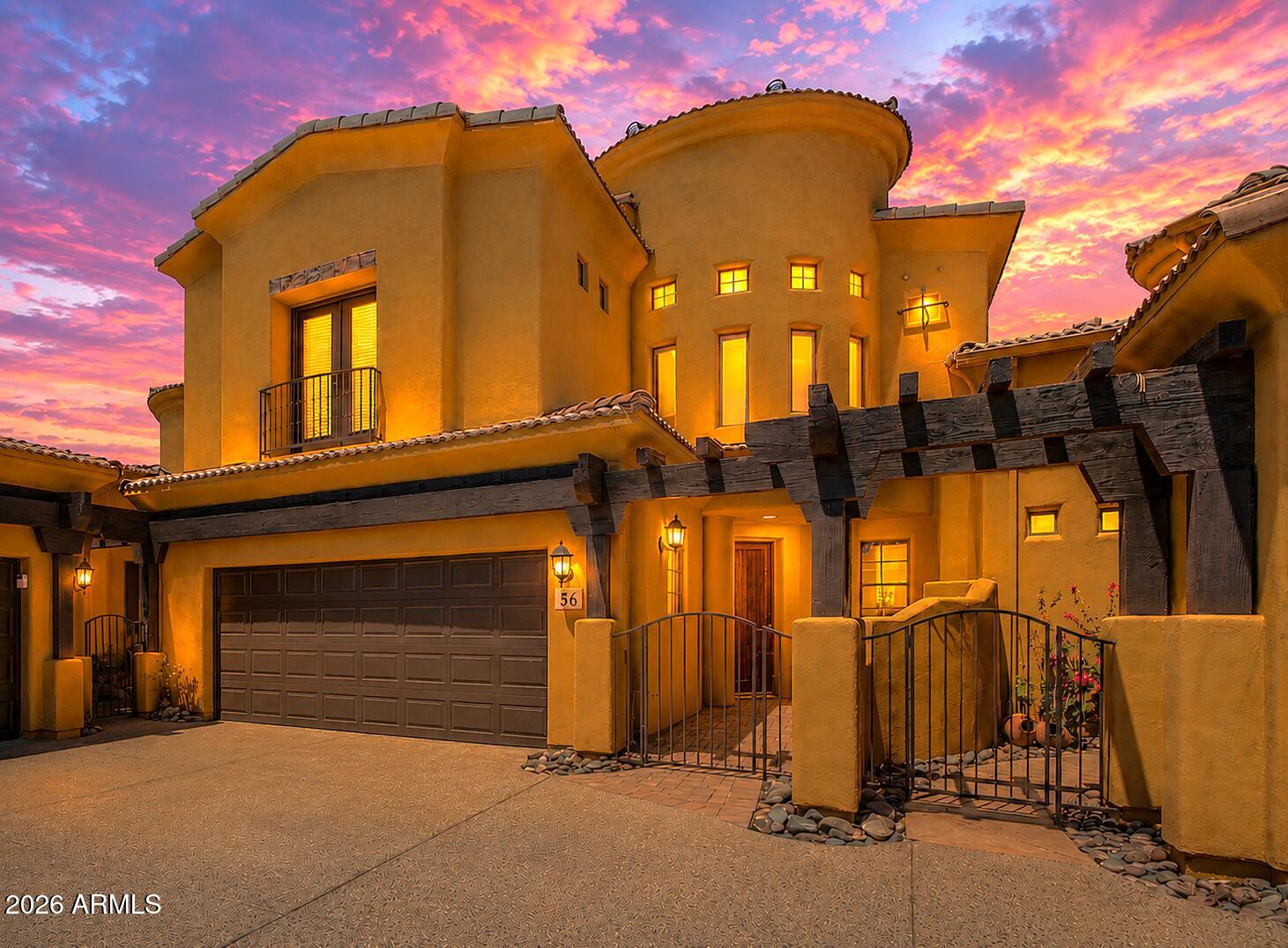 True resort style living in Gold Canyon with panoramic views of the Superstition Mountains! This unique 3 bedroom, 3 full bath, plus loft/flex space offers two Primary suites (one downstairs and upstairs) and an ensuite. Perfect for accommodating guests or multi-family living allowing plenty of privacy. Upstairs bedrooms have double doors leading to the balcony where you can enjoy coffee overlooking the serene mountain views. Vaulted ceilings and natural paint throughout provide a pristine appearance. Upstairs loft has built in wet bar perfect for unwinding or entertaining. The gated community is nestled close to many elite golf courses and hiking trails. Step outside your front door to enjoy the community pool and clubhouse with fitness center. You never have to leave your home when you live in paradise! HOA maintains roof and exterior paint that were done in 2022/2023. NEW 2025 HVAC and 2021 water heater and softener. This home is move in ready!!