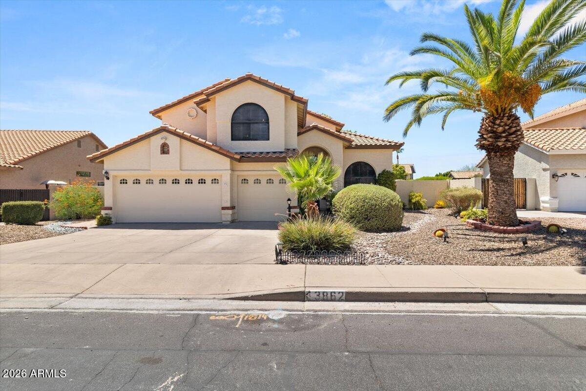 Here's your chance to own in Red Mountain Ranch! This 5-bed 2.5-bath home offers a great floor plan and even greater potential in a well-established golf course community. With a 3-car garage and a desirable location within a respected school district, this property is perfect for buyers ready to add their own style. The roof is only 6 years old and the exterior was painted last year. Step outside to a shaded backyard featuring a covered patio, grass and several mature fruit trees -- a nice everyday outdoor space for relaxing or gardening. This home is ready for its next owners - don't wait to make Red Mountain Ranch home!