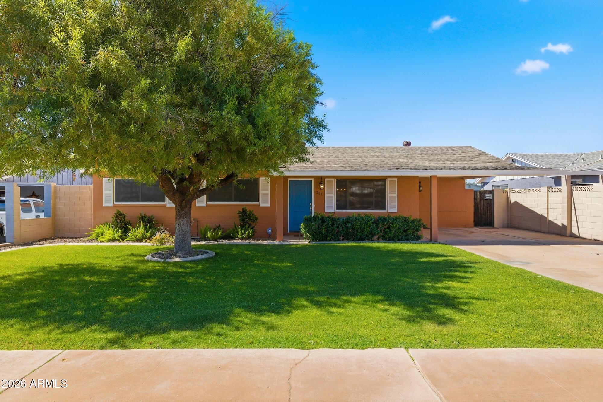 Welcome to this immaculately maintained 4-bedroom, 2-bath home. The beautifully remodeled kitchen is the heart of the home, featuring rich cabinetry, stainless steel appliances, custom backsplash, oversized island with seating, abundant storage, and an open layout that flows seamlessly into the dining and living spaces. Multiple gathering areas include a bright living room, formal dining area, and spacious family room with a cozy fireplace. The primary suite offers a peaceful retreat with its own ensuite bath. Step outside to enjoy the backyard with new turf and space to relax under the pergola. With newer A/C and a prime location near ASU, Downtown Tempe, Scottsdale, the 101, 202, Sky Harbor, parks, and the Phoenix Zoo, this home delivers the perfect blend of comfort, style, and location.