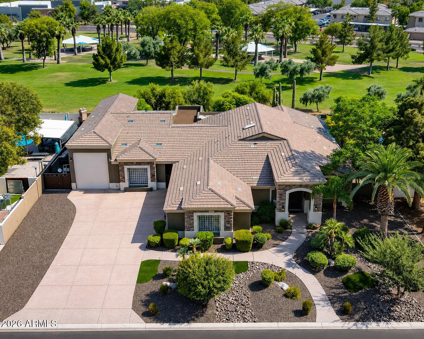Beautifully remodeled 4 bedroom, 2.5 bath residence offering 2,771 square feet of thoughtfully designed living space. The chef's kitchen features premium stainless steel appliances, under cabinet lighting, a stunning Taj Mahal quartzite oversized island, and designer finishes throughout. The luxurious primary suite showcases a freestanding soaking tub and spa inspired bath. Outdoors, enjoy a resort style backyard with a play pool, water feature, and putting green. Car enthusiasts and adventurers will appreciate the 65 foot climate controlled RV garage with attached storage, additional RV parking with slab and clean out, and a detached 980 square foot casita offering 2 bedrooms and 2 baths ideal for guests, multigenerational living, or rental opportunities.