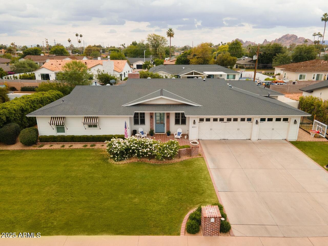 Nestled in the heart of Scottsdale's prestigious Arcadia neighborhood, this exquisite single-story residence offers an unparalleled blend of comfort and elegance. Built in 2005, the home spans approximately 3,200 square feet and is situated on a generous 0.32-acre lot, providing ample space for both indoor and outdoor living. Boasting 11 foot ceilings through the main living areas and with 5 bedrooms, a dedicated office, and 3.5 baths, this home has ample space for living and entertaining guests. The gourmet kitchen is equipped with modern appliances and ample counter space, perfect for culinary enthusiasts. Adjacent to the kitchen, the dining area overlooks the beautifully landscaped backyard, allowing for picturesque views during meals. Step outside to discover a private oasis featuring a sparkling pool and a spacious patio area, ideal for Arizona's sunny days and cool evenings. The expansive backyard offers plenty of room for outdoor activities and entertaining. Additional amenities include a 3-car garage, updated AC units, hot water heater, pool equipment and new irrigation system. Located within the highly regarded Scottsdale Unified School District, this property is zoned for Hopi Elementary School, Ingleside Middle School, and Arcadia High School.