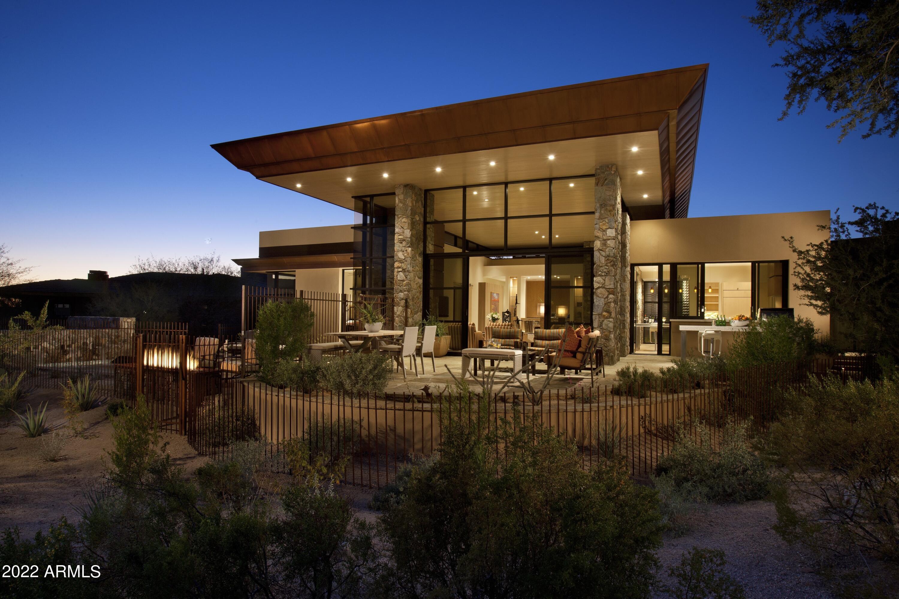 Fabulous Frank Lloyd Wright Inspired home, Eric Peterson designed, & built by Salcito Homes on the second golf hole at The Country Club at DC Ranch. Custom flooring, cabinetry, lighting & finishes combined with a neutral pallet.  Open, light & bright Great Room plan, chefs kitchen with SS appliances & glass wall wine cellar, inviting master with relaxing bath with soaking tub, & indoor & outdoor showers. Generous sized guest rooms all en-suite, & an open office to enjoy the McDowell Mountain views.   Outdoor entertaining area with pool, spa, BBQ area, firepit & room to entertain.  Additional features include Savant Smart Home System, central vac  & additional home generator. Convenient location close to DC Ranch Market Street, & all the shopping & restaurants North Scottsdale has to offer.