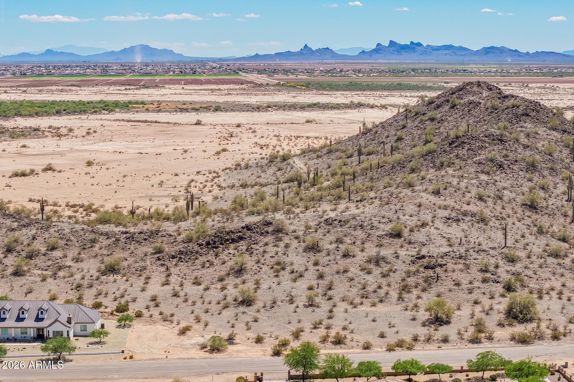 Improved Building Site, Homes only, Ready to build on. Site is level in front by road and slopes up to hillside, very nice parcel with easy building site yet offering privacy from neighbors to the back of the property. Az Water to lot line, APS transformer across the street. Survey all corners marked. In proximity to Shopping, dining, hiking, and biking in the Casa Grande Mountain. Park at the end of Arica Rd.  There is no HOA no dues. There is an Archtectural Control Board, The only thing we are responsible for is reviewing and approving any construction in the community that requires a permit. The ACB's intentions are to protect the community's property values by keeping a consistent look and feel to our neighborhoods in compliance with the CC&Rs established. Be careful very rocky terrai